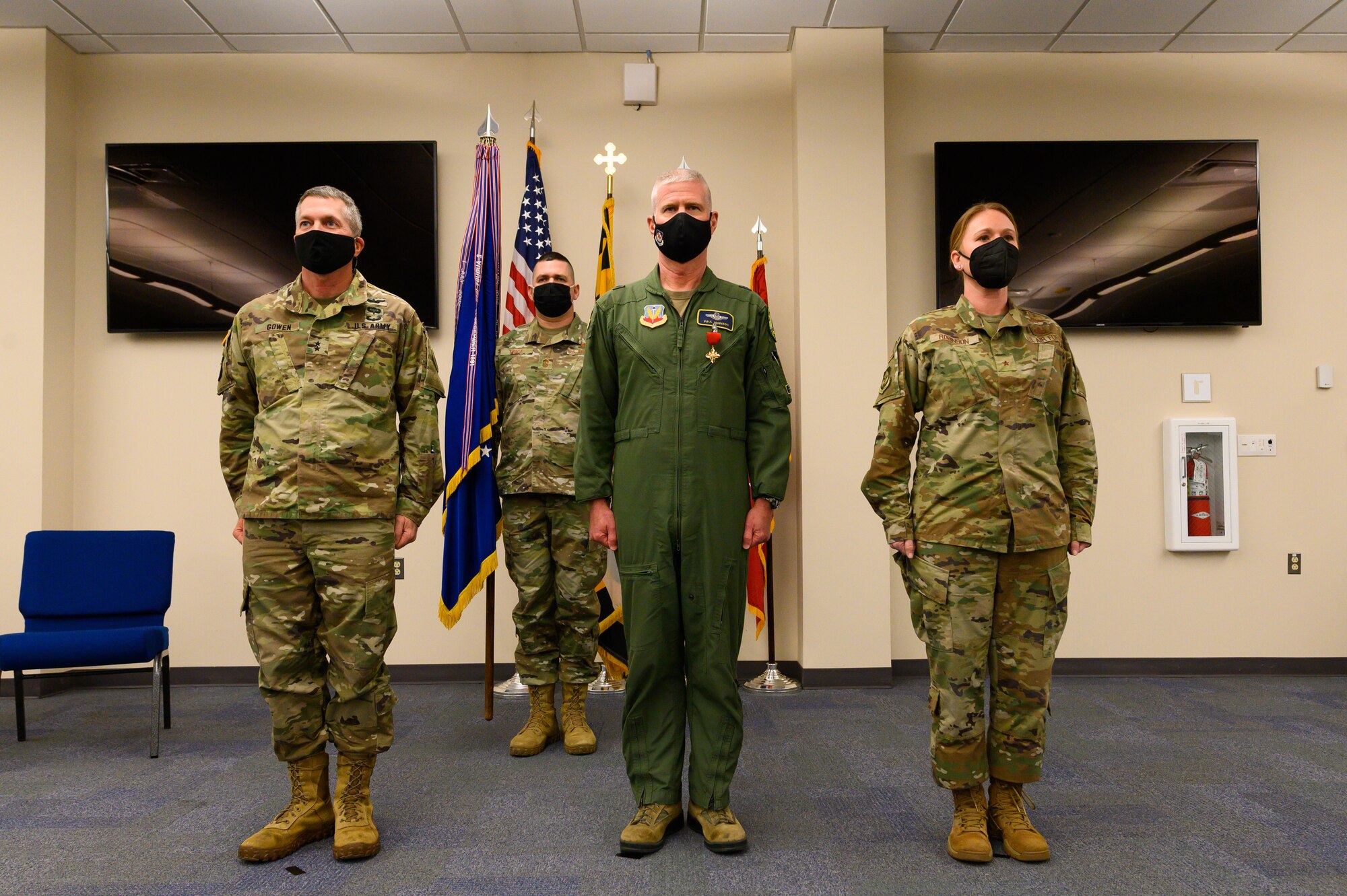 U.S. Army Maj. Gen. Timothy E. Gowen, the adjutant general for Maryland, U.S. Air Force Brig. Gen. Paul D. Johnson, the commander of the 175th Wing, and U.S. Air Force Brig. Gen. Jori A. Robinson, the incoming commander, stand at attention during a change of command ceremony on Jan. 7, 2022, at Warfield Air National Guard Base at Martin State Airport, Middle River, Maryland. Members of the Maryland National Guard gathered for the socially distanced ceremony to bid farewell to Johnson, the outgoing commander, and welcomed U.S. Air Force Brig. Gen. Jori A. Robinson, the incoming commander.