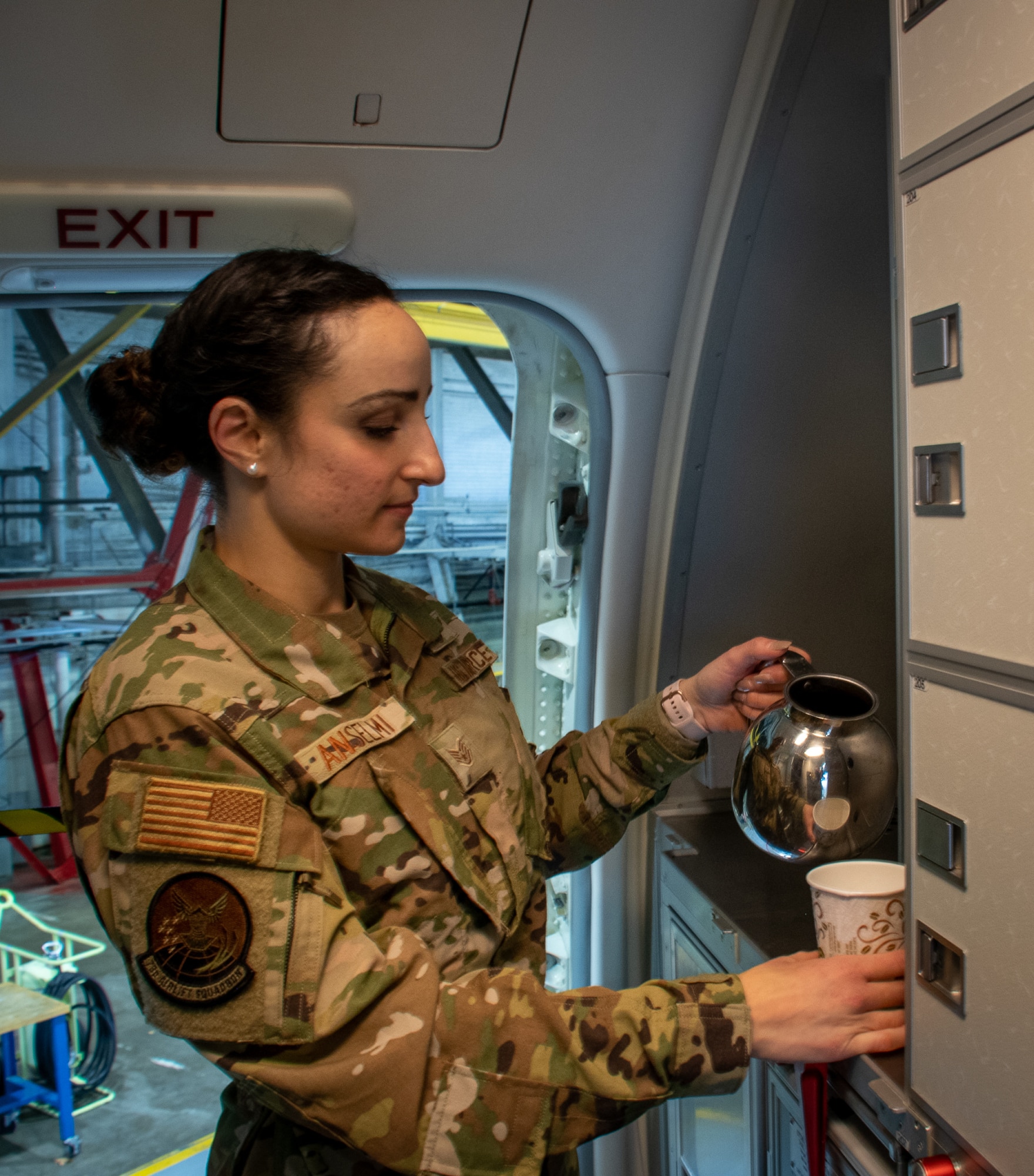 There are many reasons for why Airmen join the military.  Some want to follow in the footsteps of their family, travel the world, or earn education benefits.  
One Air Force Reserve flight attendant had other motivations, which began after earning her private pilot’s license at the age of 18 in Italy.
Staff Sgt. Carola Anselmi, 73rd Airlift Squadron flight attendant, a native of a town called Catania, in Sicily, Italy, immigrated to the U.S.  After immigrating, she later joined the Air Force to further her aviation career, but then transferred to the AF Reserves to become a flight attendant.
Though Anselmi had a strong background in aviation and aeronautical engineering at the time she enlisted, she was placed in the bioenvironmental engineering career field.