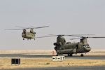Task Force Phoenix Over the Horizon (OTH) force CH-47 Chinook helicopters arrive at Camp Buehring, Kuwait, Aug. 3, 2021. The helicopters are flown by crews from Task Force Phoenix's 1st Battalion, 171st Aviation Regiment (General Support Aviation Battalion), from the Minnesota and Iowa National Guard.
