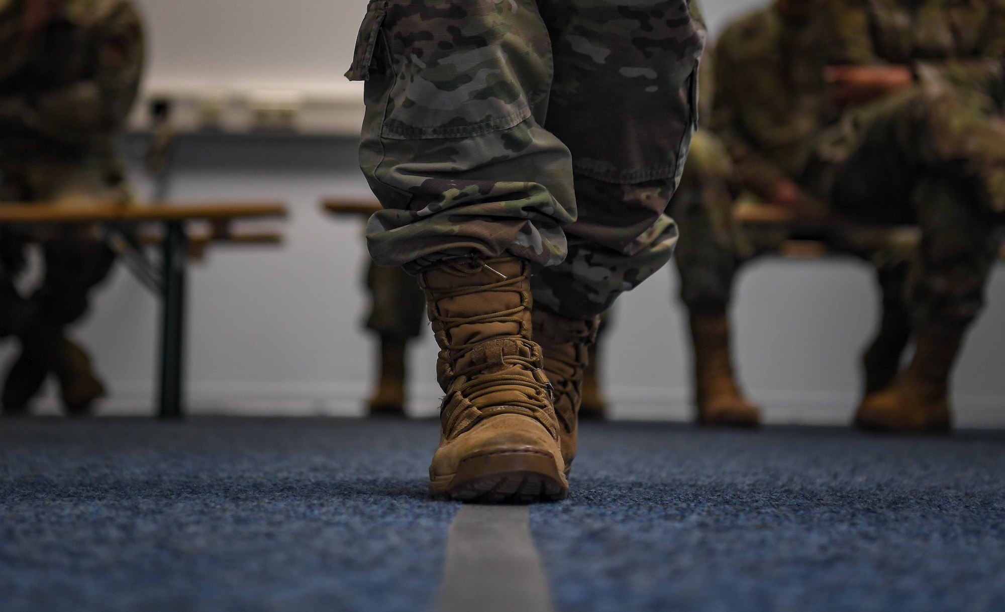 U.S. Air Force Senior Airman DeLanie Smith, 86th Maintenance Group maintenance analyst, performs the walk and turn test during a Wet Lab event at Ramstein Air Base, Germany, Dec. 16, 2021. The walk and turn test is one of the standard field sobriety tests that 569 USFPS personnel perform to determine if someone is driving under the influence of alcohol. (U.S. Air Force photo by Airman Jared Lovett)