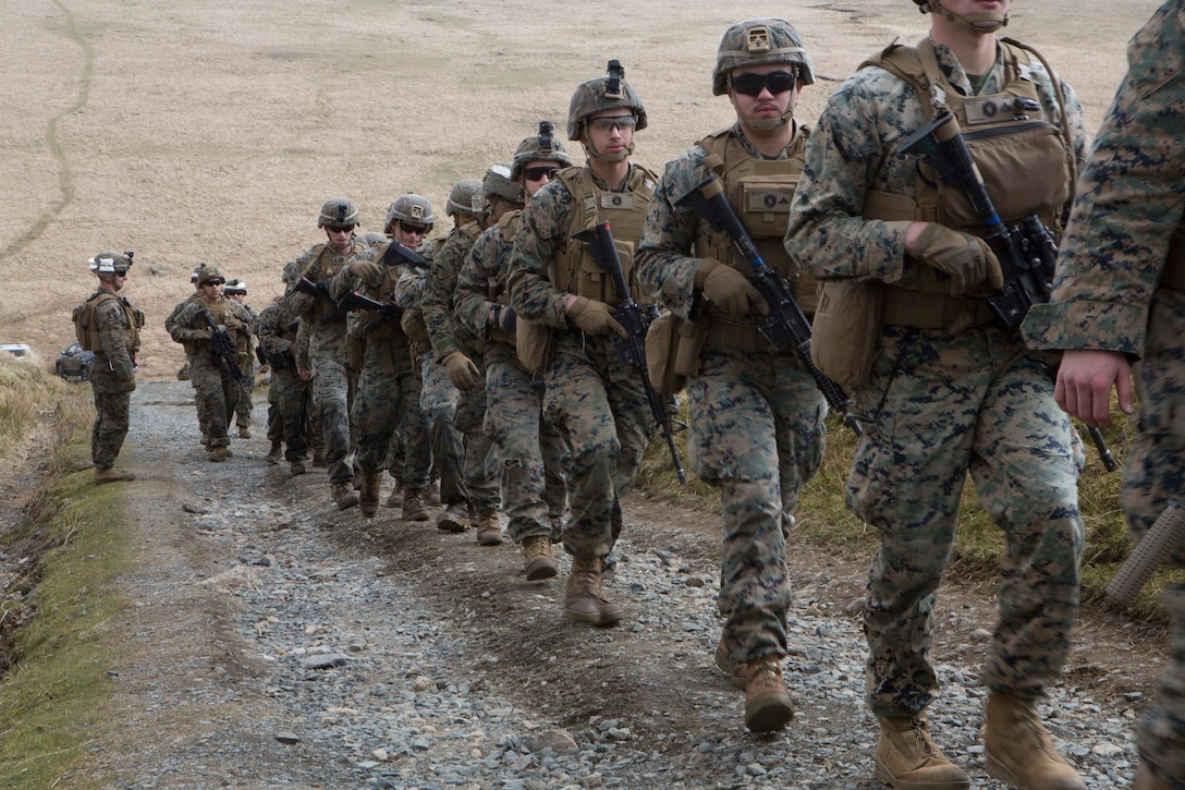 MERRIVATE RANGE, United Kingdom, April 14, 2021- U.S. Marines with Battalion Landing Team 1/8, 24th Marine Expeditionary Unit (MEU) move to a training area during squad fire and maneuver drills at Merrivate Range, United Kingdom, April 14, 2021. 24th MEU, embarked with the Iwo Jima Amphibious Ready Group, is forward deployed in the U.S. Sixth fleet area of operations in support of U.S. national security interests in Europe and Africa. (U.S. Marine Corps photo by Staff Sergeant Mark E Morrow Jr/Released)