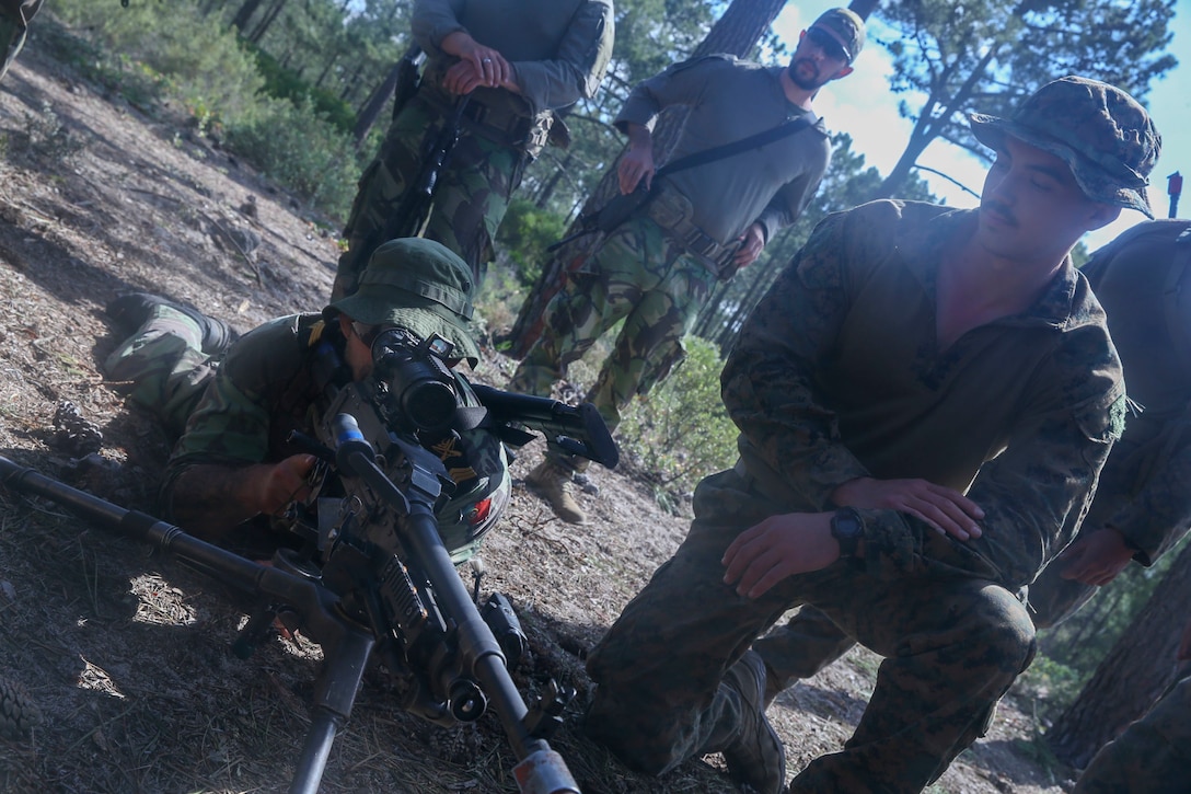 PINHEIRO DA CRUZ, Portugal (May 7, 2021) U.S. Marines with the 24th Marine Expeditionary Unit (MEU) exchange weapons systems knowledge with Fuzileiros (Portuguese Marines) during CONTEX-PHIBEX, a bilateral amphibious exercise between the U.S. and Portuguese naval services, May 7, 2021. 24th MEU, embarked with the Iwo Jima Amphibious Ready Group, is forward deployed in the U.S. Sixth Fleet area of operations in support of U.S. national security interests in Europe and Africa. (U.S. Marine Corps photo by Lance Cpl. Nicholas Guevara)