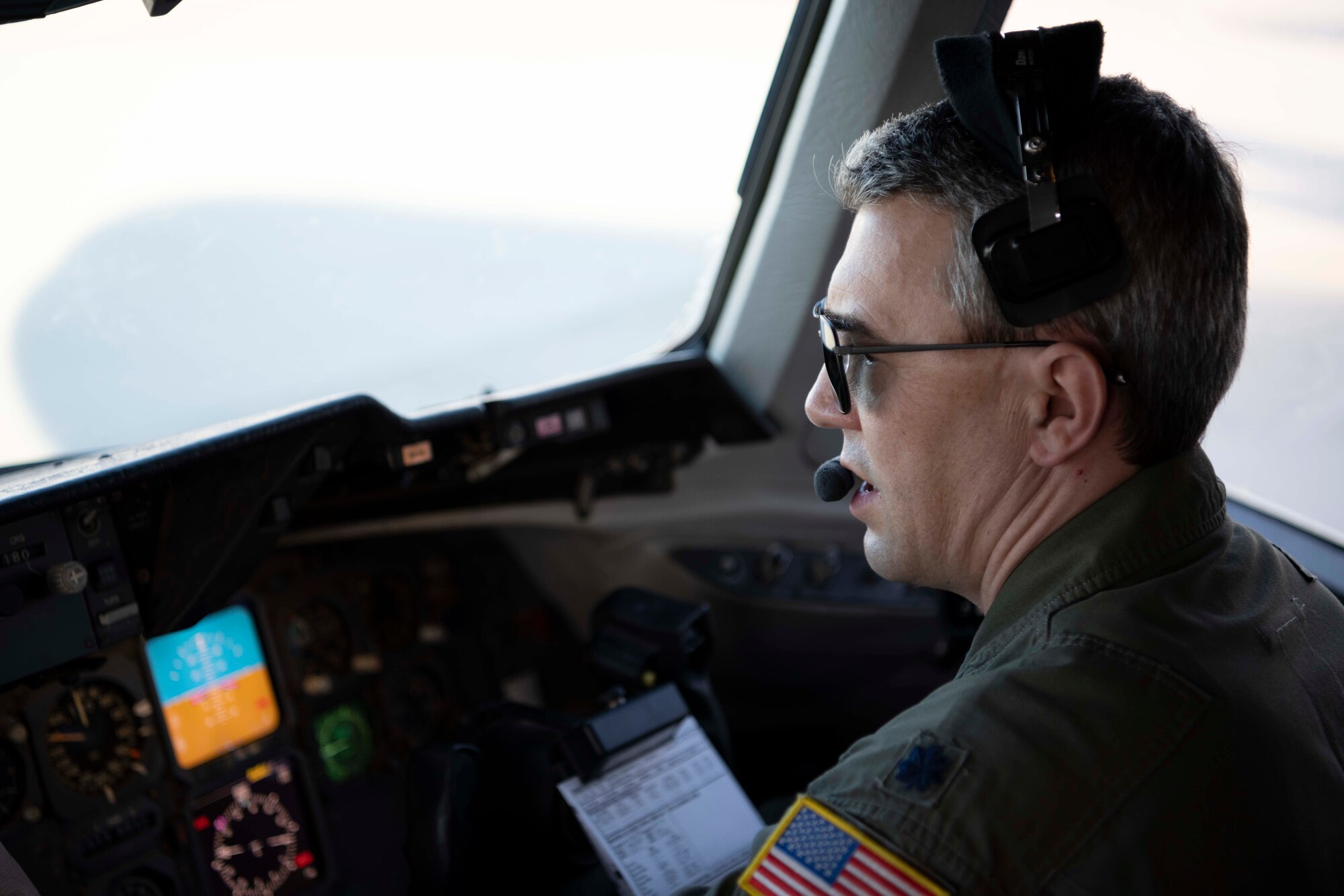 U.S. Air Force Staff Sgt. Taylor Dickson, 70th Aerial Refueling Squadron KC-10 Extender boom operator, operates the boom stick of a KC-10 Jan. 1, 2022, over southern California. The 70th ARS and 79th ARS offloaded 55,000 pounds of fuel to a B-2 spirit bomber in support of a flyover at the Rose Bowl and Tournament of Roses parade in Pasadena California. (U.S. Air Force photo by Senior Airman Alexander Merchak)