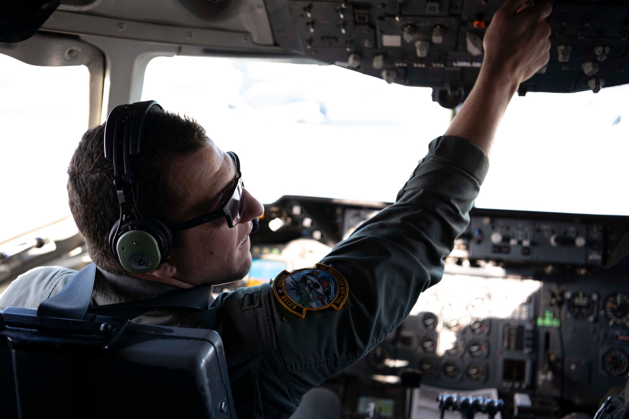 U.S. Air Force Staff Sgt. Taylor Dickson, 70th Aerial Refueling Squadron KC-10 Extender boom operator, operates the boom stick of a KC-10 Jan. 1, 2022, over southern California. The 70th ARS and 79th ARS offloaded 55,000 pounds of fuel to a B-2 spirit bomber in support of a flyover at the Rose Bowl and Tournament of Roses parade in Pasadena California. (U.S. Air Force photo by Senior Airman Alexander Merchak)