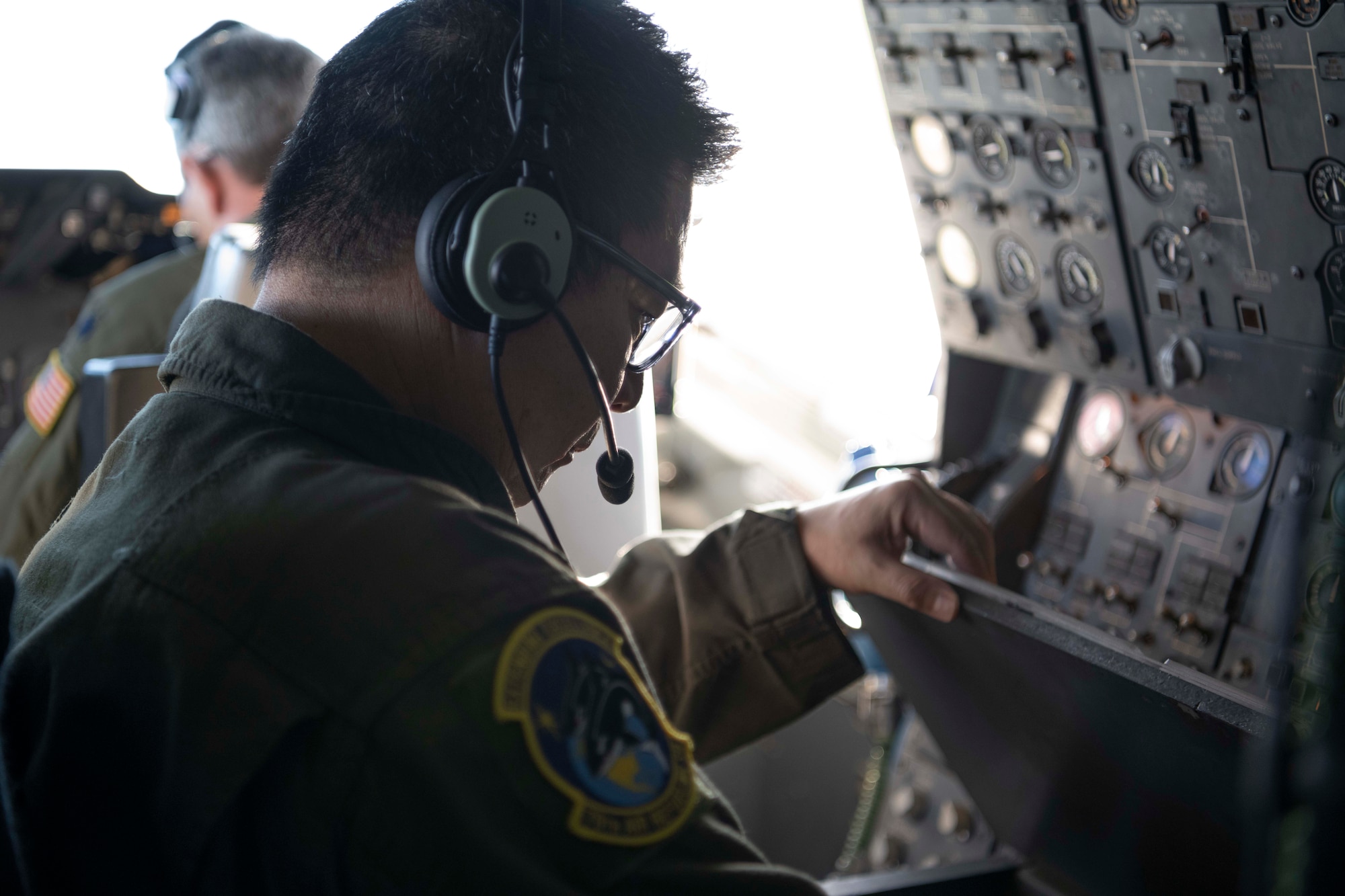U.S. Air Force Staff Sgt. Taylor Dickson, 70th Aerial Refueling Squadron KC-10 Extender boom operator, operates the boom stick of a KC-10 Jan. 1, 2022, over southern California. The 70th ARS and 79th ARS offloaded 55,000 pounds of fuel to a B-2 spirit bomber in support of a flyover at the Rose Bowl and Tournament of Roses parade in Pasadena California. (U.S. Air Force photo by Senior Airman Alexander Merchak)