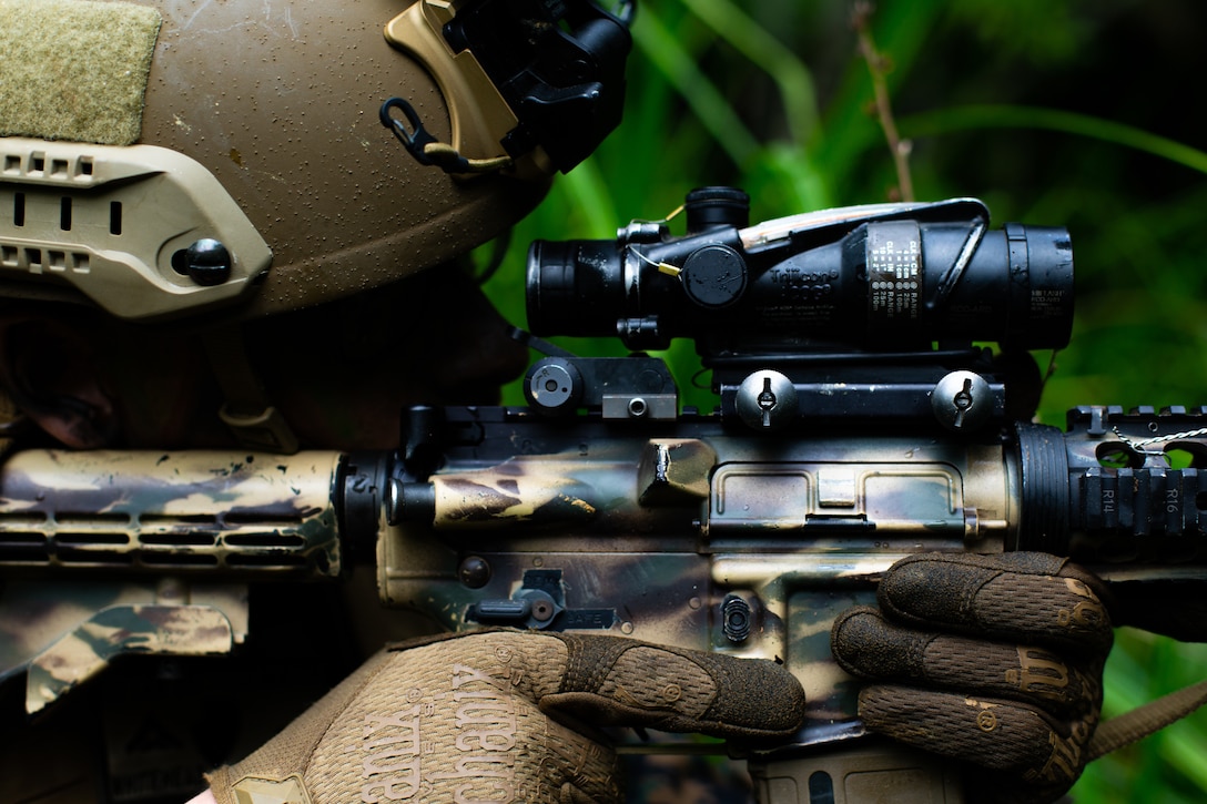 U.S. Marine Corps Lance Cpl. Logan Whitehead, an antitank missile gunner with 3rd Light Armored Reconnaissance Battalion, provides security during the squad attack phase of the 3rd Marine Division Squad Competition at the Jungle Warfare Training Center on Camp Gonsalves, Okinawa, Japan, Jan. 6, 2022. The week-long competition tests jungle survival skills, basic infantry tactics, and excellence in weapons handling. The competition participants are forward-deployed in the Indo-Pacific under 4th Marines, 3rd Marine Division, as a part of the Unit Deployment Program. Whitehead is a native of Burnsville, Minnesota.