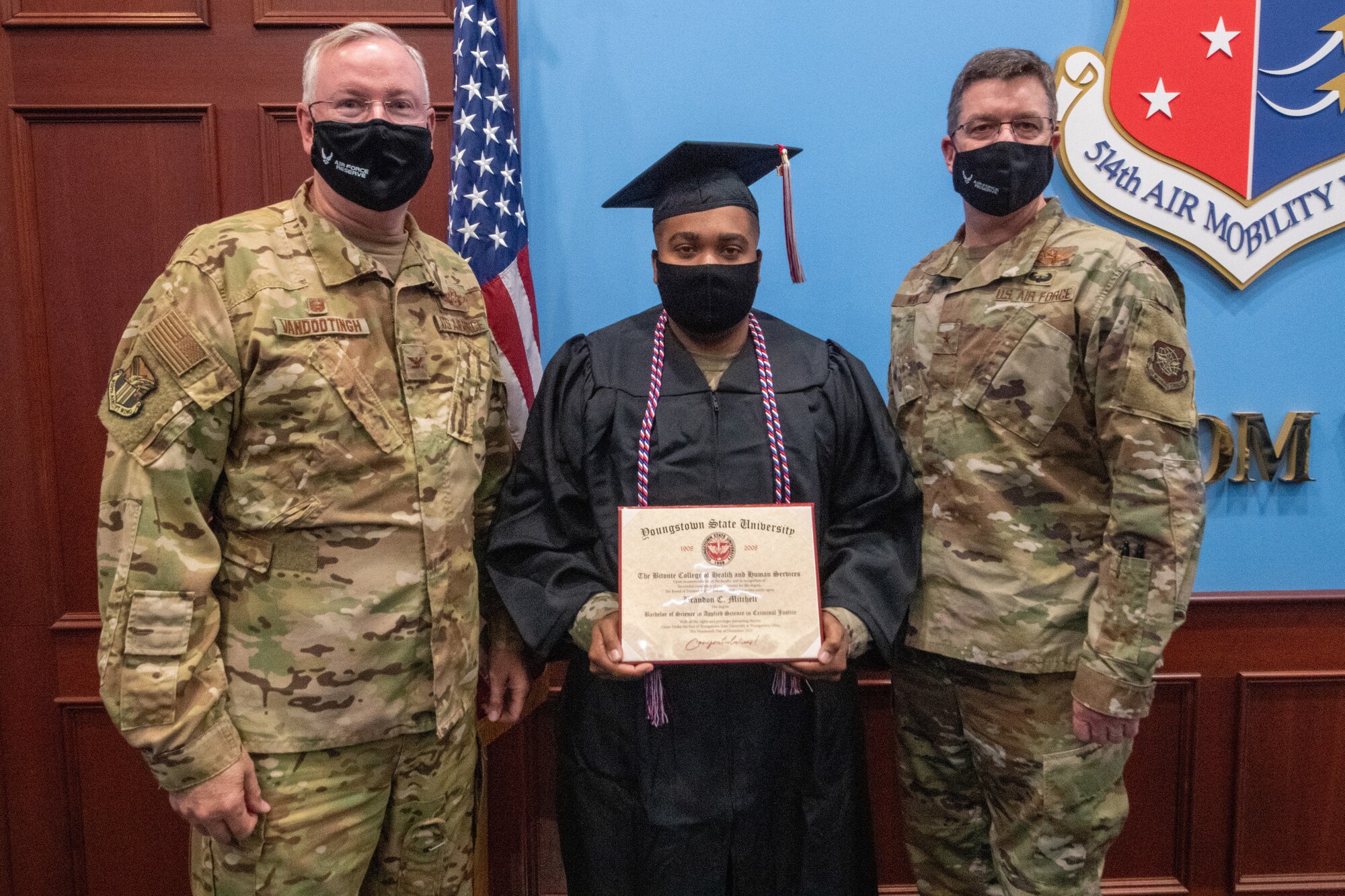 Senior Airman Brandon Mitchell, a passenger services apprentice with the 76th Aerial Port Squadron at Youngstown Air Reserve Station, Ohio, received his diploma from Youngstown State University on time, despite being deployed during the commencement ceremony, via a special delivery by leadership from his home installation and deployed location.