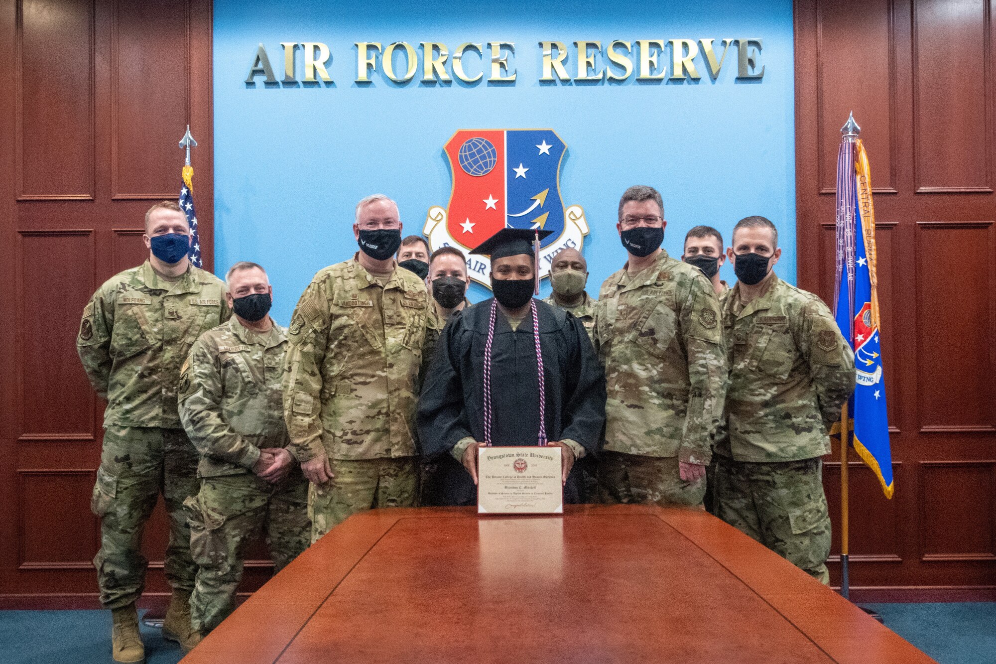 Senior Airman Brandon Mitchell, a passenger services apprentice with the 76th Aerial Port Squadron at Youngstown Air Reserve Station, Ohio, received his diploma from Youngstown State University on time, despite being deployed during the commencement ceremony, via a special delivery by leadership from his home installation and deployed location.
