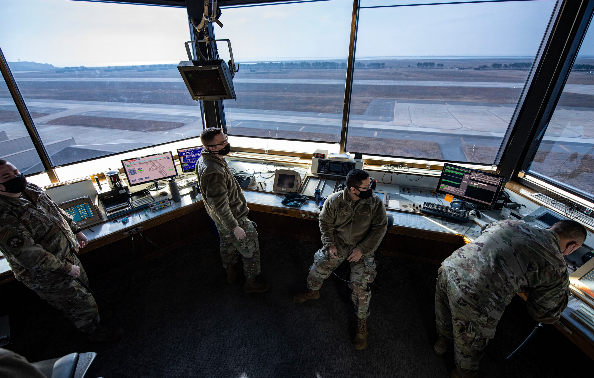 Air traffic controllers assigned to the 8th Operations Support Squadron direct aircraft at Kunsan Air Base, Republic of Korea, Jan. 10, 2021. Air traffic controllers are responsible for managing the flow of aircraft through all aspects of their flight to ensure the safety and efficiency of air traffic on the ground and in the air. (U.S. Air Force photo by Staff Sgt. Suzie Plotnikov)