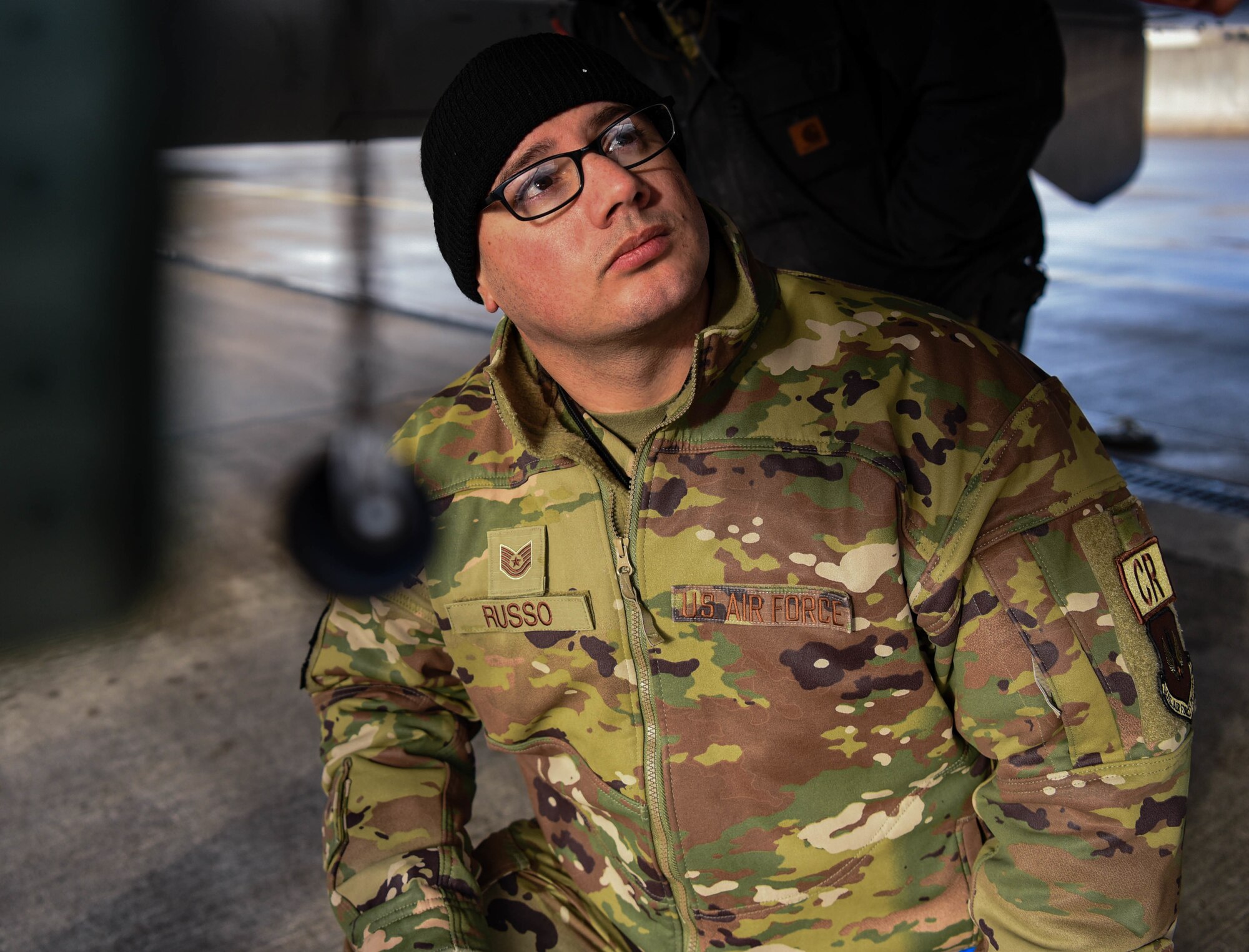 Airman observes aircraft maintenance training.