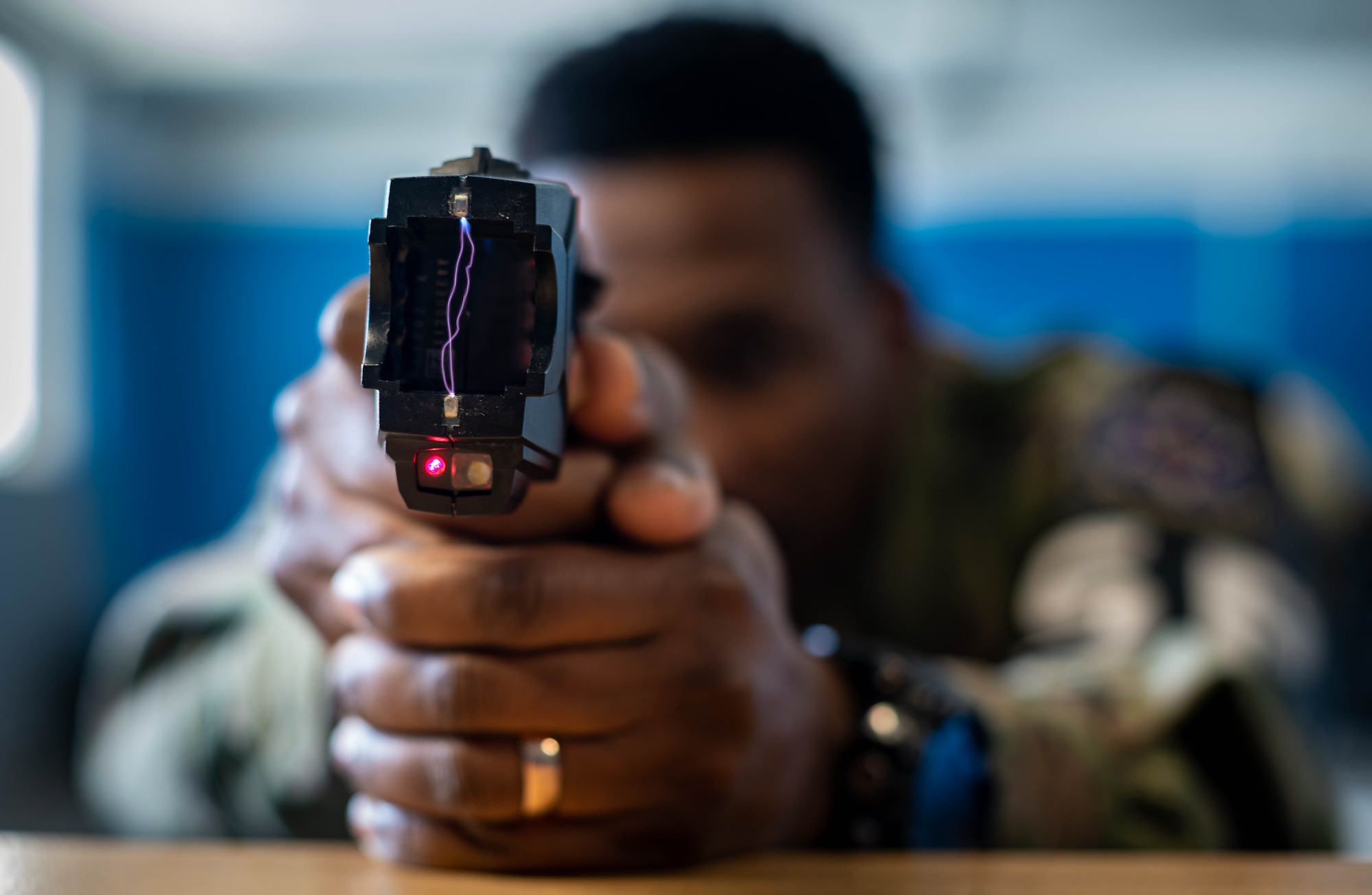 U.S. Air Force Staff Sgt. William Murray, 569th United States Forces Police Squadron unit training instructor, utilizes the drive-stun feature on a Taser X26P at Vogelweh Air Station, Germany, Nov. 29, 2021. In the event that an officer misses when shooting the weapon, they are able to use the weapon as a direct-contact stun, called the drive-stun, which is designed for pain compliance. (U.S. Air Force photo by Airman Jared Lovett)