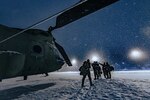 U.S. Army aircrew from Company B, 2nd Battalion, 238th General Support Aviation, Peoria, Ill., walks away from their CH-47 “Chinook” after a night mission during Winter Strike 21 at Alpena Combat Readiness Training Center, Mich., Jan 28, 2021. The Northern Strike 22 exercise will unite service members from several states and partner forces Jan. 21-30 at Camp Grayling Joint Maneuver Training Center and Alpena Combat Readiness Training Center.