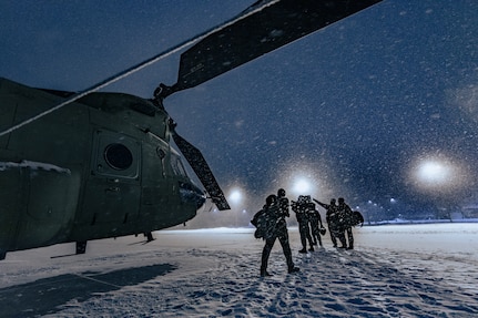 U.S. Army aircrew from Company B, 2nd Battalion, 238th General Support Aviation, Peoria, Ill., walks away from their CH-47 “Chinook” after a night mission during Winter Strike 21 at Alpena Combat Readiness Training Center, Mich., Jan 28, 2021. The Northern Strike 22 exercise will unite service members from several states and partner forces Jan. 21-30 at Camp Grayling Joint Maneuver Training Center and Alpena Combat Readiness Training Center.