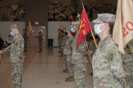 Oklahoma Army National Guard Soldiers with the 45th Field Artillery Brigade, stand at parade rest during a change of command ceremony at the Armed Forces Reserve Center in Mustang, Oklahoma, Jan. 8, 2022. The Guardsmen honored outgoing commander Col. Jason Henry and welcomed incoming commander Col. Thomas J. Gibson. (Oklahoma National Guard photo by Sgt. 1st Class Mireille Merilice-Roberts)