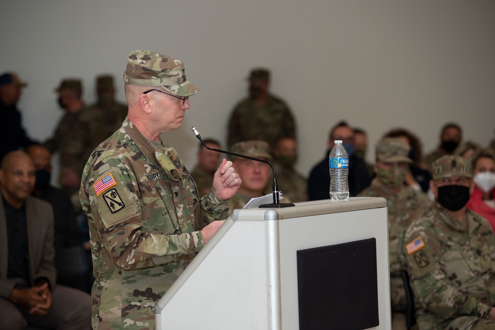 Oklahoma Army National Guard Col. Jason Henry addresses Soldiers with the 45th Field Artillery Brigade during a change of command ceremony at the Armed Forces Reserve Center in Mustang, Oklahoma, Jan. 8, 2022. Henry has received multiple awards in his career to include the Meritorious Service Medal, Bronze Star and Humanitarian Service Medal.  His service was commemorated with the pinning of the Legion of Merit award in recognition of his exceptionally meritorious conduct.(Oklahoma National Guard photo by Sgt. 1st Class Mireille Merilice-Roberts)
