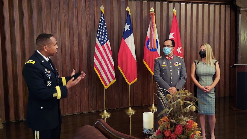 Col. Jorge Salinas, the Chilean Army partner nation liaison officer at U.S. Army South, receives an award from Maj. Gen. William L. Thigpen, Army South commanding general, during an award ceremony recognizing his two years at the command on January 7, 2022.