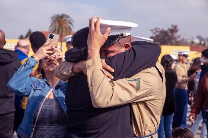 A new U.S. Marine of Mike Company, 3rd Recruit Training Battalion, is welcomed by a loved one following a graduation ceremony at Marine Corps Recruit Depot San Diego, Jan. 7,