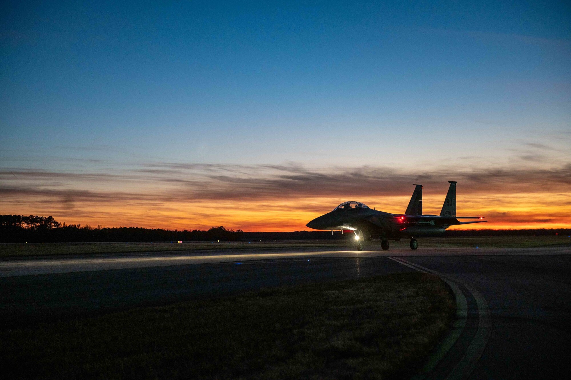 A F-15E Strike Eagle aircraft prepares for take off at Seymour Johnson Air Force Base, North Carolina, Nov. 29, 2021. The aircraft uses two crew members, a pilot and a weapon systems officer to fly the aircraft. (U.S. Air Force photo by Airman 1st Class Sabrina Fuller)