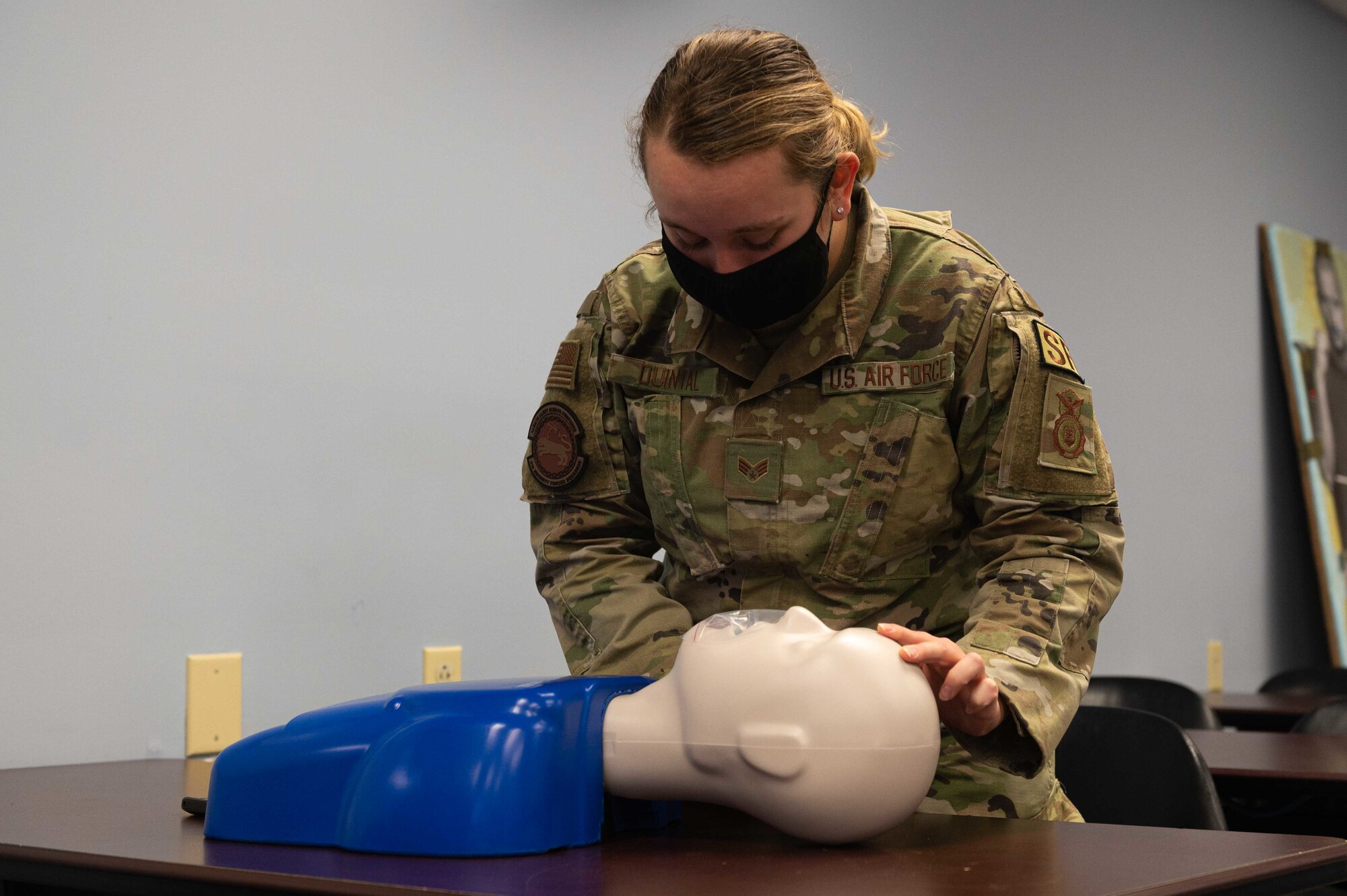 Senior Airman Juliette Quintel, 4th Security Forces Squadron defender, practices CPR on a mannequin during a CPR certification class at Seymour Johnson Air Force Base, North Carolina, Nov. 9, 2021. Part of the training is to perform a rapid assessment for responsiveness and help unresponsive adults, children and infants. (U.S. Air Force photo by Airmen 1st Class Sabrina Fuller)
