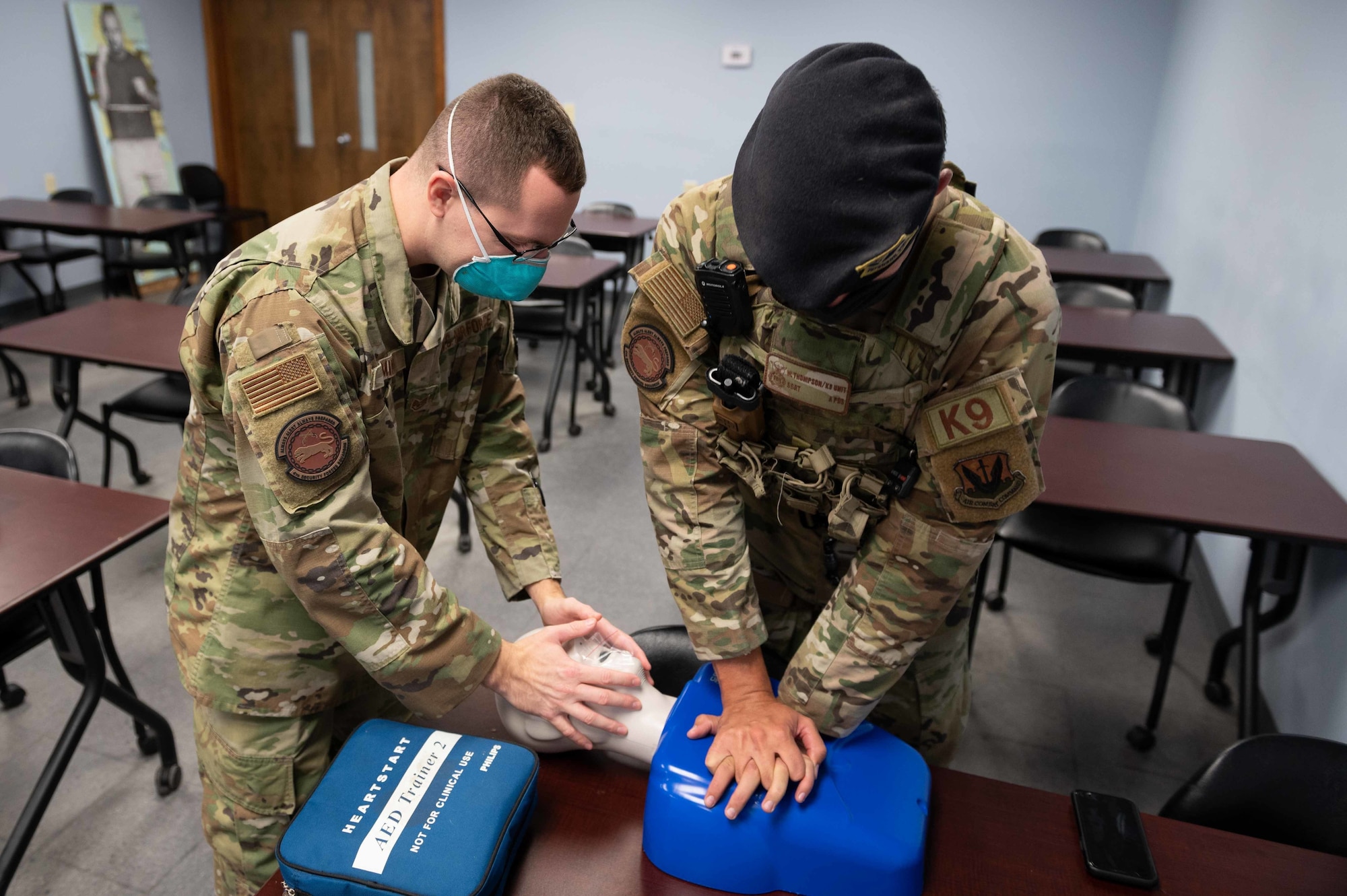 Staff Sgt. Joseph Gimino, left, 4th Security Forces Squadron patrolman and Staff Sgt. Will Thompson, 4th SFS military working dog handler, perform CPR on a mannequin during a CPR class at Seymour Johnson, North Carolina, Nov. 9, 2021. Thompson performed a set of 30 chest compressions while Gimino held the airway open. (U.S. Air Force photo by Airmen 1st Class Sabrina Fuller)