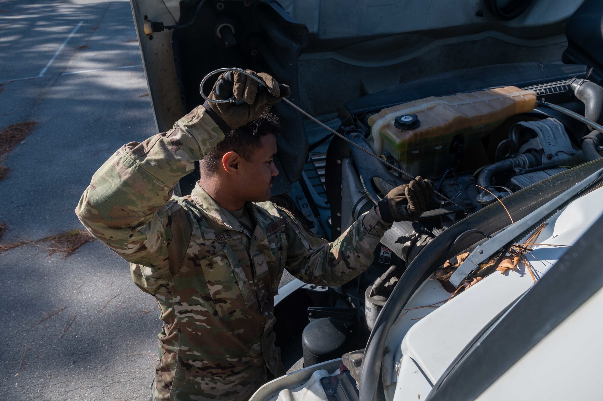 Airman 1st Class Lamar Daniels, 4th Logistics Readiness Squadron ground transportation vehicle operator, checks fuels on 10-ton tractor (semi) at Seymour Johnson Air Force Base, North Carolina, Dec. 3, 2021. The 4th LRS controls the receipt, storage and issue of 45 million gallons of fuel and cryogenics annually. (U.S. Air Force photo by Airman 1st Class Sabrina Fuller)