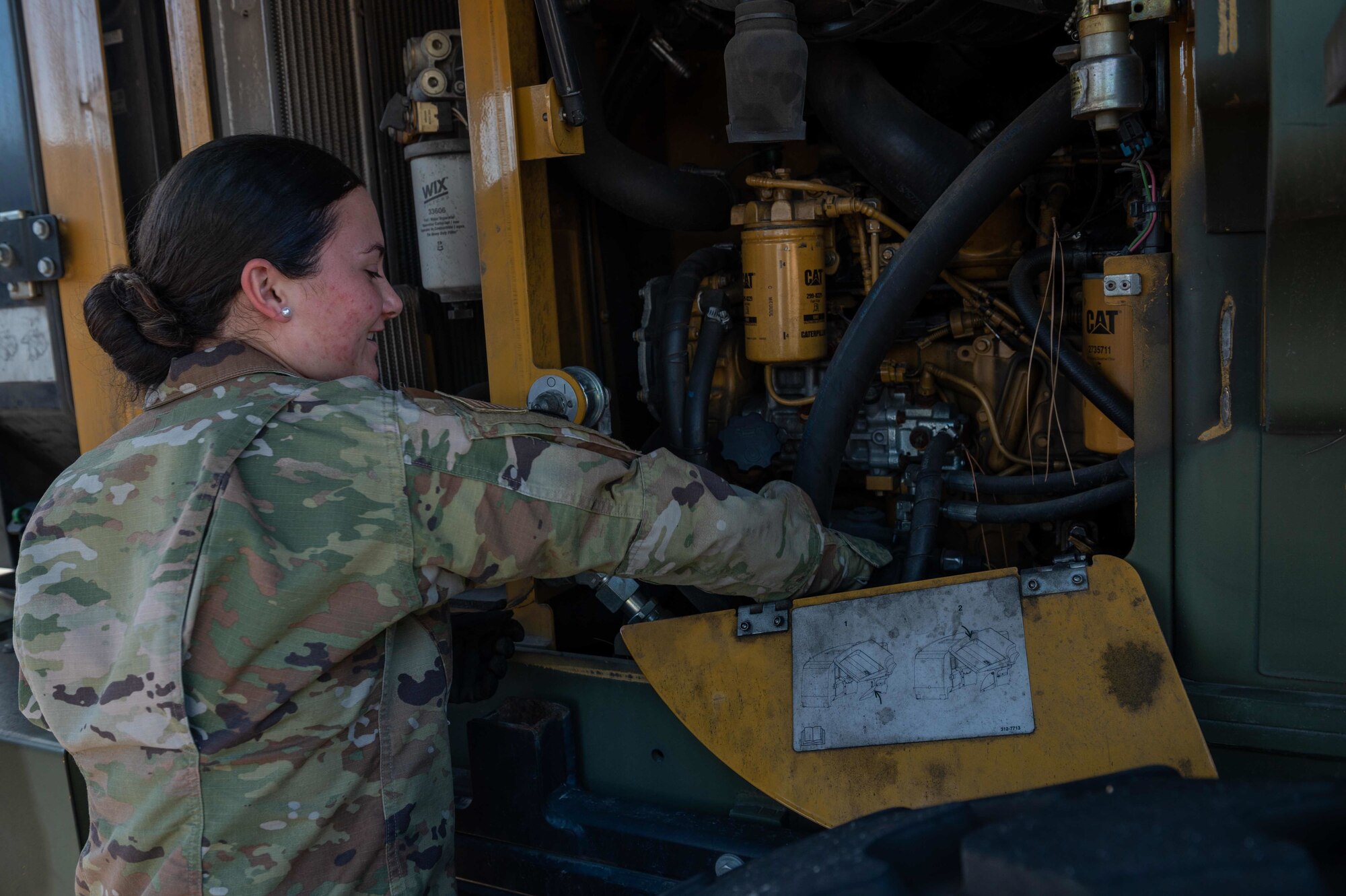 Airman Jasmine Cardin, 4th Logistics Readiness Squadron ground transportation vehicle operator, checks fuels on 10K All Terrain forklift at Seymour Johnson Air Force Base, North Carolina, Dec. 3, 2021. The squadron provides worldwide logistics support for the 4th Fighter Wing’s F-15E Strike Eagle aircraft and support units. (U.S. Air Force photo by Airman 1st Class Sabrina Fuller)