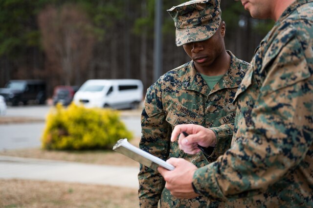 A Marine Combat Engineer sets off a satchel charge that blasts a