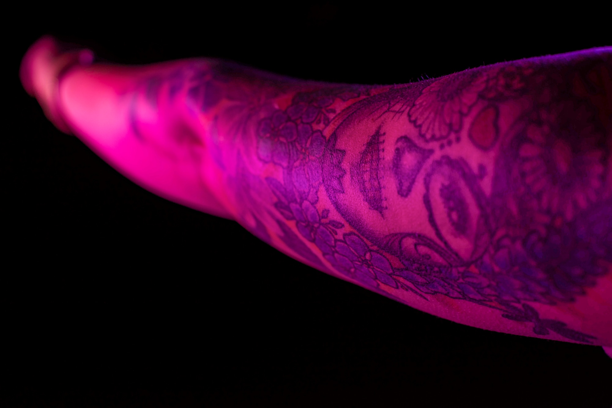 Staff Sgt. Carla Berner, 4th Operational Medicine Readiness Squadron NCO in charge of occupational health, discusses significance of tattoos for Seymour Ink Tattoo series at Seymour Johnson Air Force Base, North Carolina, Dec. 7, 2021. Berner’s tattoo was inspired by the Day of the Dead and the recognition of loved ones who have passed away. (U.S. Air Force photo by Airman 1st Class Sabrina Fuller)