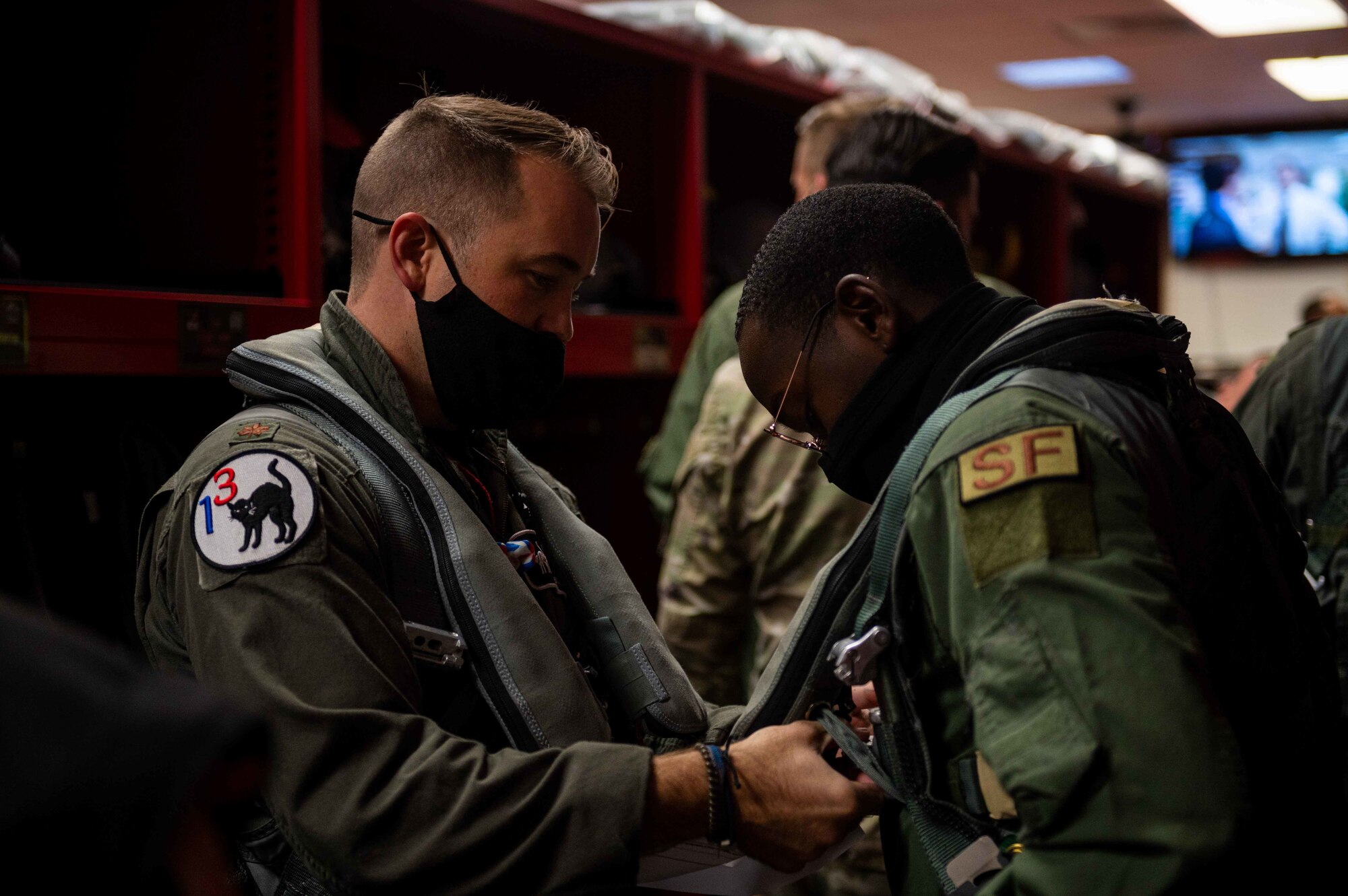 An Airman with the 4th Security Forces Squadron, suits up for an incentive flight at Seymour Johnson Air Force Base, North Carolina, Nov. 5th, 2021. Incentive flight recipients were flown in F-15E Strike Eagles. (U.S. Air Force photo by Airmen 1st Class Sabrina Fuller)