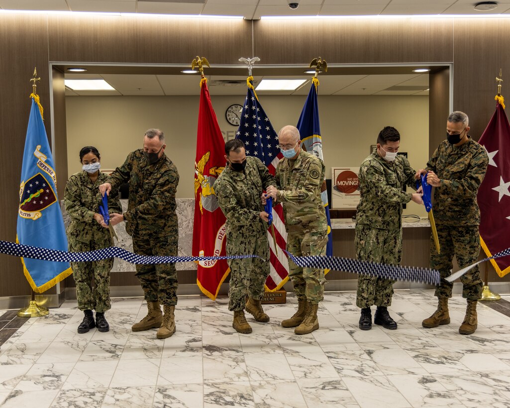 From left to right, U.S. Marine Corps Lt. Gen. William M. Jurney, commanding general of II Marine Expeditionary Force, U.S. Army Lt. Gen. Ronald Place, Director of the Defense Health Agency, and Brig. Gen. Andrew M. Niebel, commanding general, Marine Corps Installations-East, cut the ribbon to declare the new building for 2d Dental Battalion operational on Marine Corps Base Camp Lejeune, N.C., Jan. 10, 2022. The new building will enhance the readiness of 2d Dental Battalion by broadening their capabilities and combining several clinics in one central location. (U.S. Marine Corps photo by Sgt. Elizabeth Gerber)
