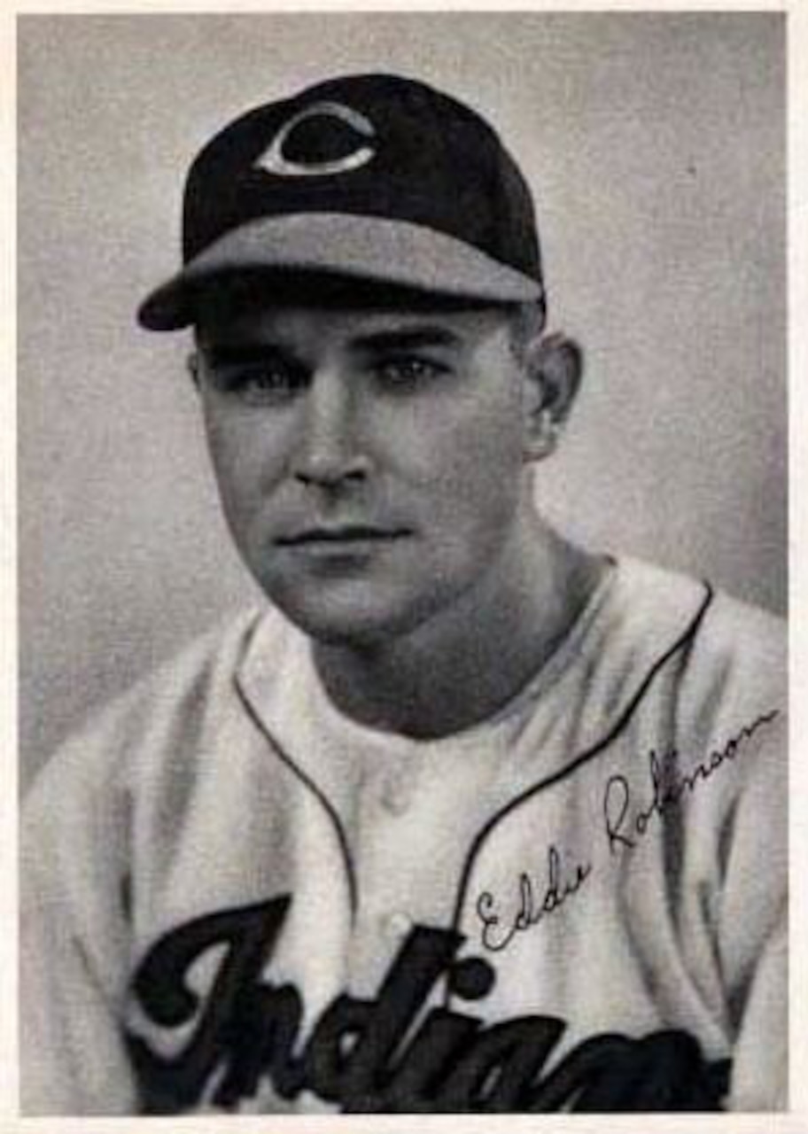 A baseball player poses for a photo.