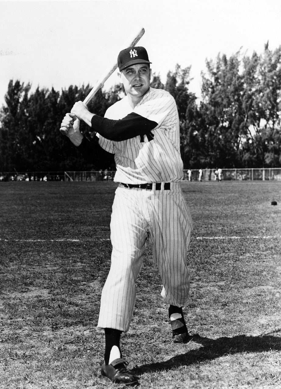 A baseball player poses for a photo.