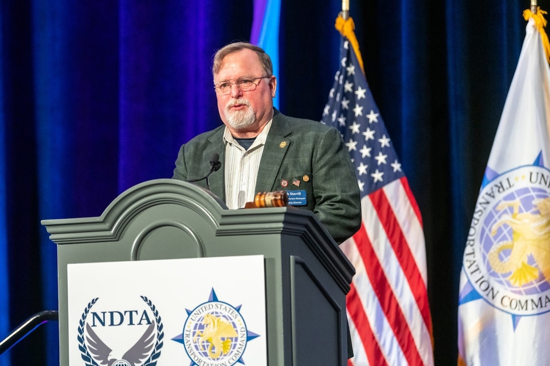 Bob Sherrill, Defense Logistics Agency Indo-Pacific, gives a speech to the NDTA assembly during an award presentation after receiving the Joseph A. Torsani Memorial Award for Lifetime Service and Achievement.