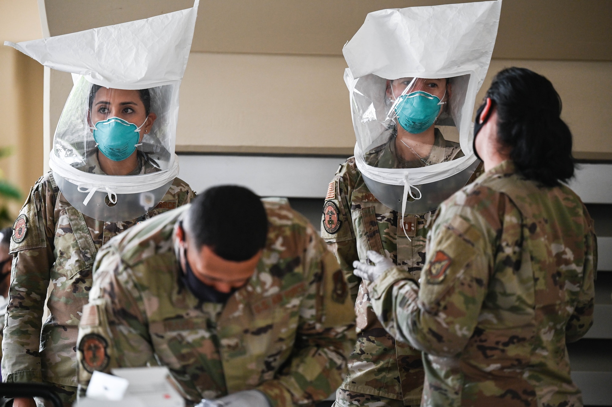 Airmen assigned to the 15th Operational Medical Readiness Squadron bioenvironmental flight perform N95 mask fit test on 15th Medical Group personnel at Joint Base Pearl Harbor-Hickam, Hawaii, Jan. 7, 2022. Airmen were exposed to a pungent solution before wearing personal protective gear, acquainting them with the smell and allowing them to easily indicate if the solution is detectable through their masks. (U.S. Air Force photo by Staff Sgt. Alan Ricker)