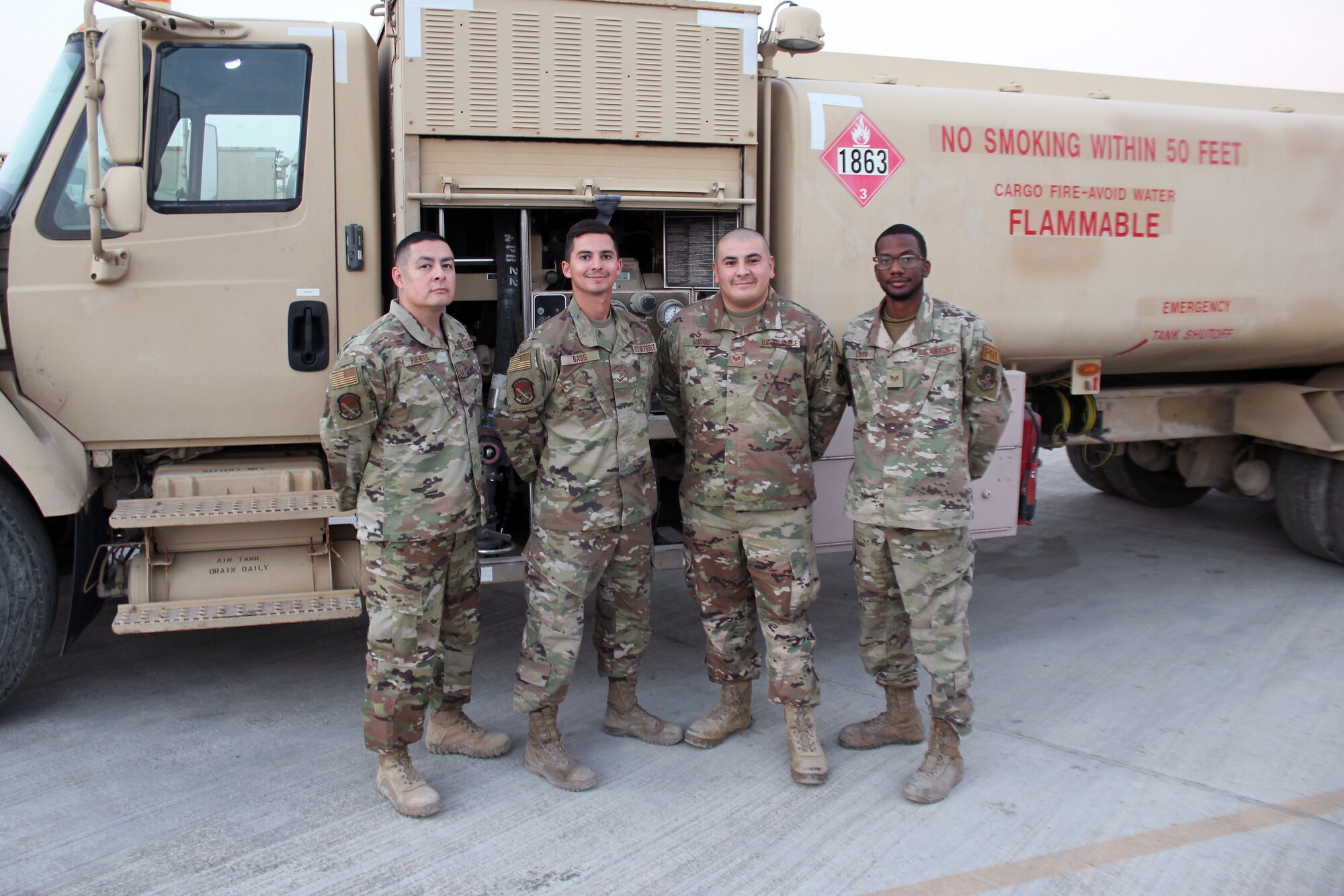 Tech. Sgt. Alfredo Fuentes, Senior Airman Ryan Bass, Staff Sgt. Anthony Madrid and Staff Sgt. Andru Lingo work in the petroleum, oil and lubricants yard at Al Dhafra Air Base, United Arab Emirates, Dec. 11, 2021. All four Airmen are members of the Air Force Reserve’s 944th Fighter Wing at Luke Air Force Base in Arizona. (U.S. Air Force photo by Master Sgt. Dan Heaton)