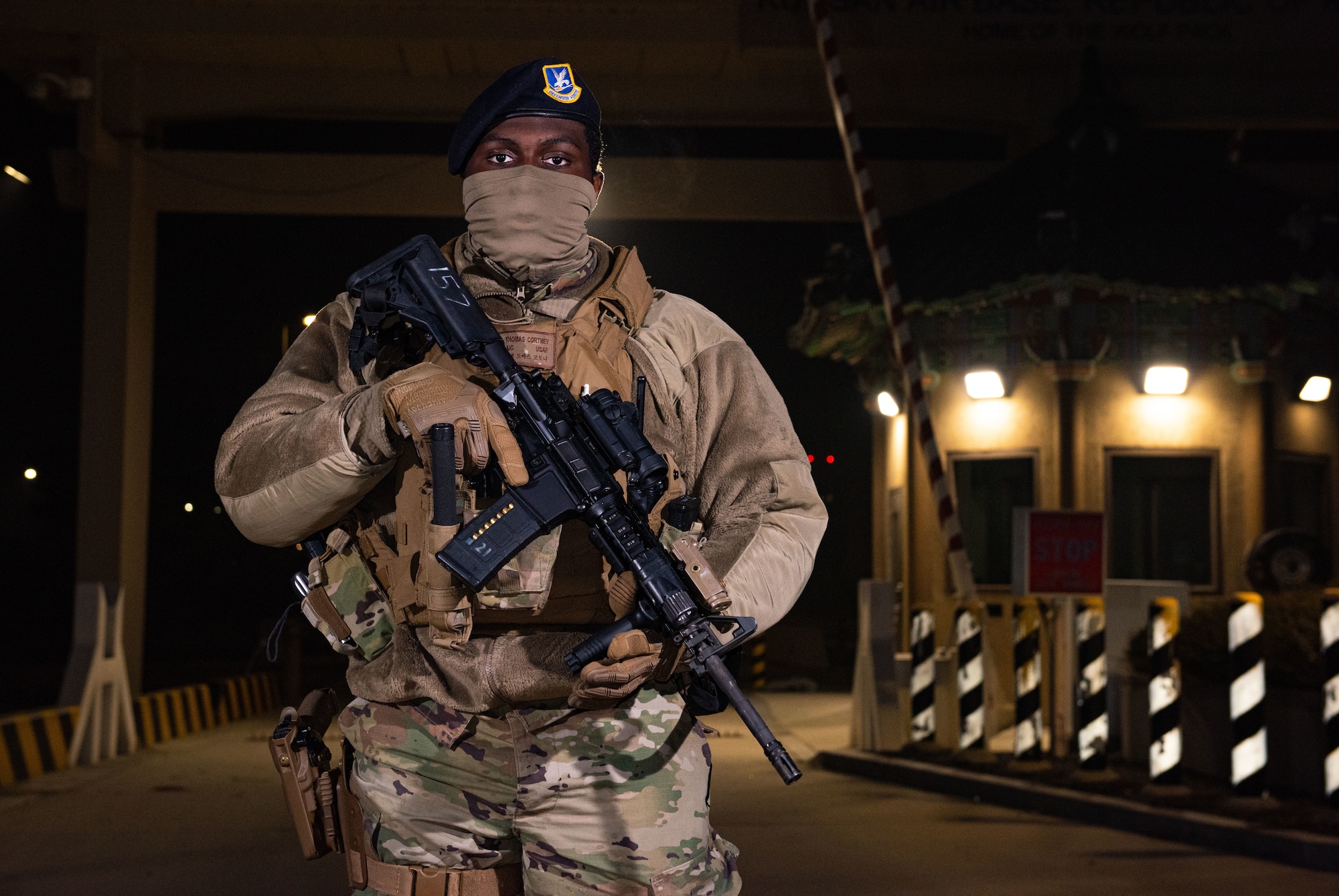 Airman 1st Class Cortney Thomas Jr., 8th Security Forces Squadron installation entry controller, provides security for the main gate at Kunsan Air Base, Republic of Korea, Jan. 10, 2021. Whether manning the gates, patrolling the base, or working at the Base Defense Operation Center, 8th SFS defenders keep the Wolf Pack safe 24/7. (U.S. Air Force photo by Staff Sgt. Gabrielle Spalding)