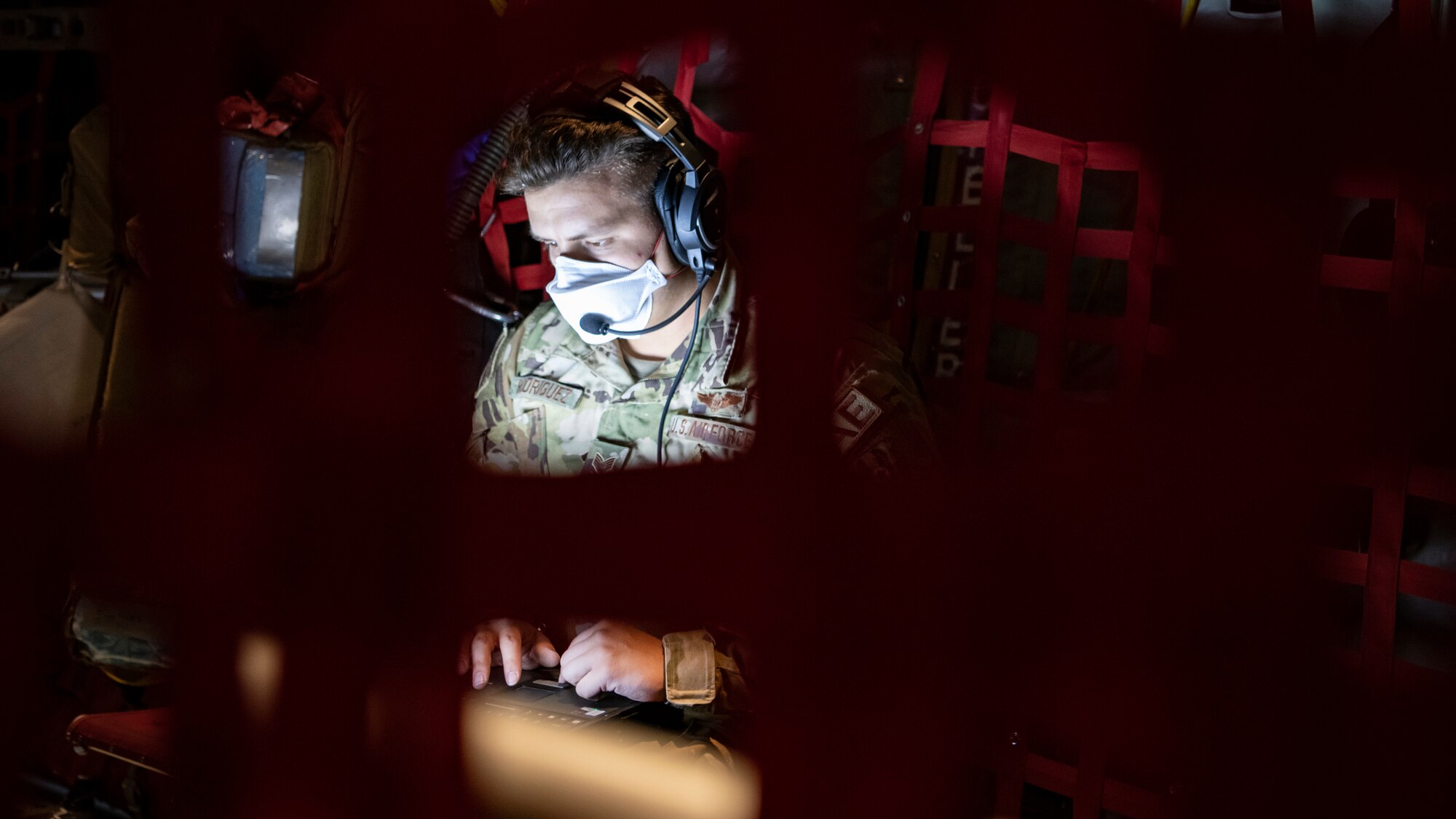 Airman typing on a computer.