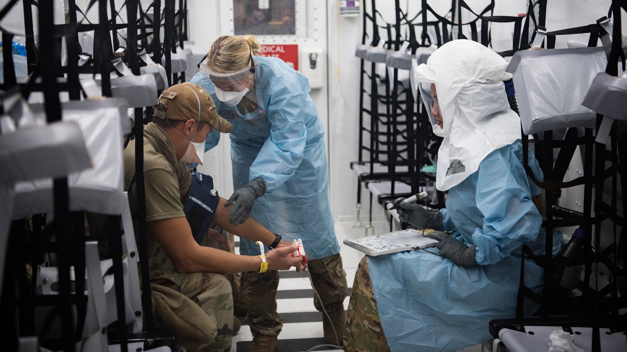Airmen taking care  of patients.