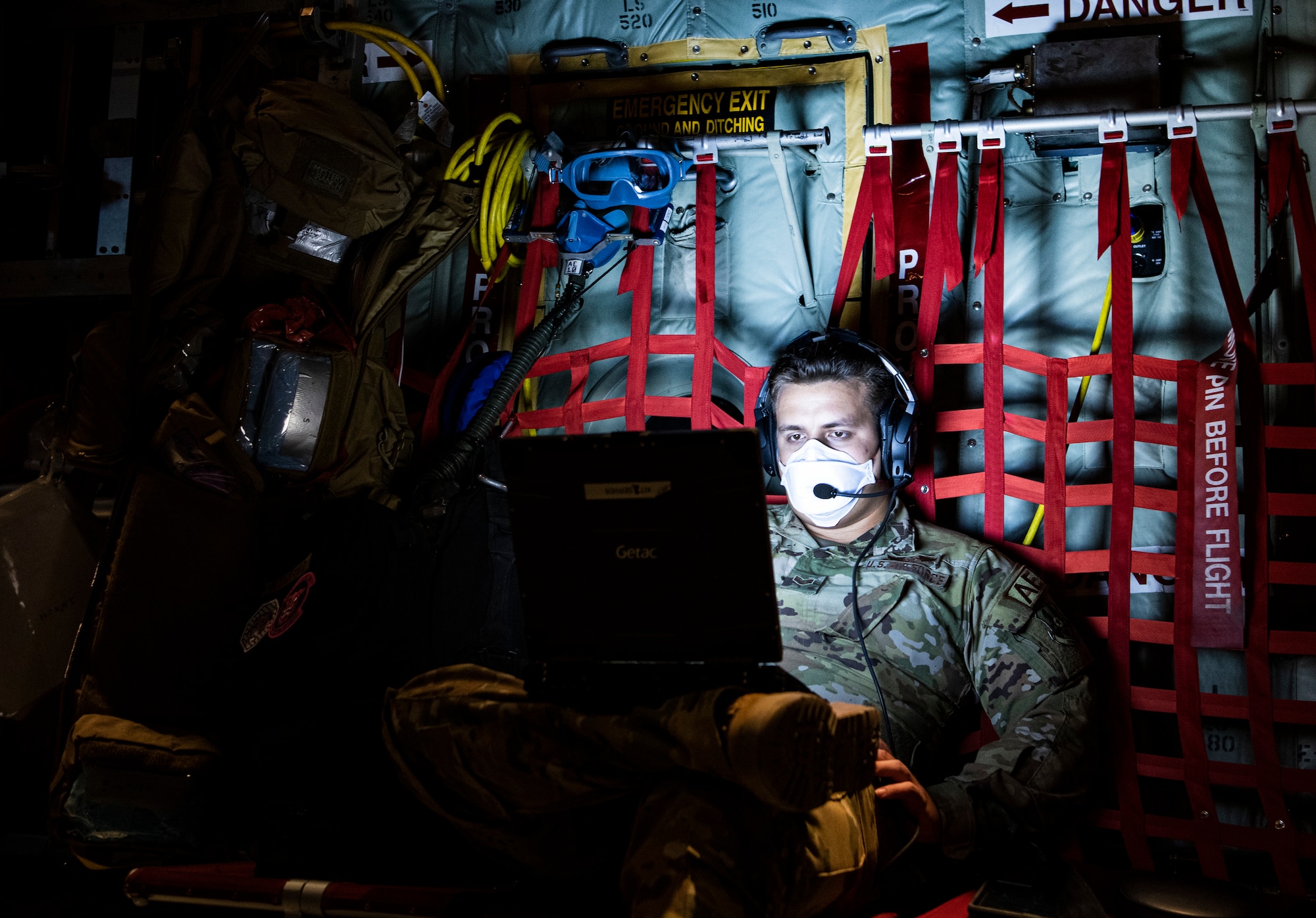 Airman typing on a computer