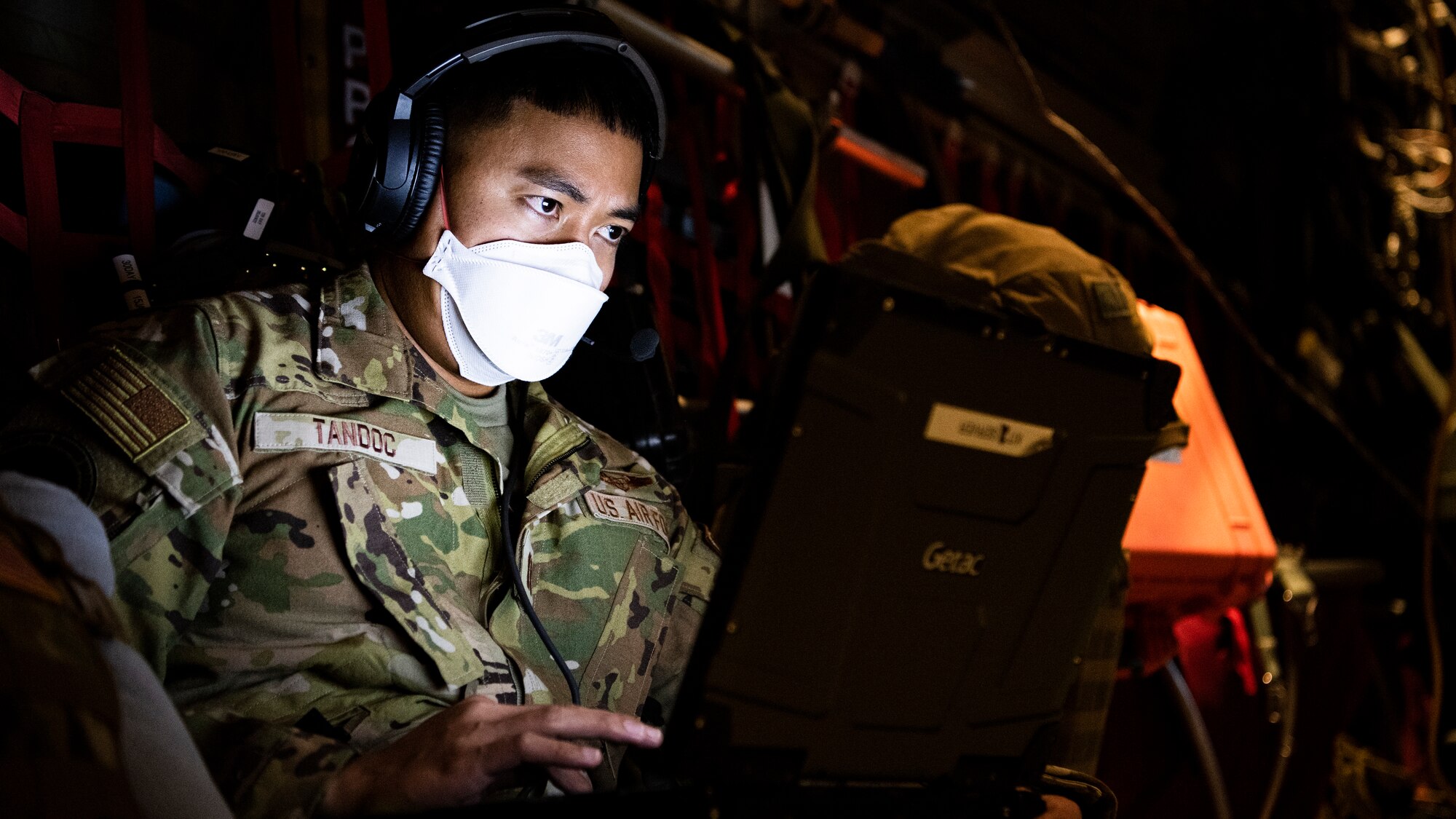 Airman typing on a computer