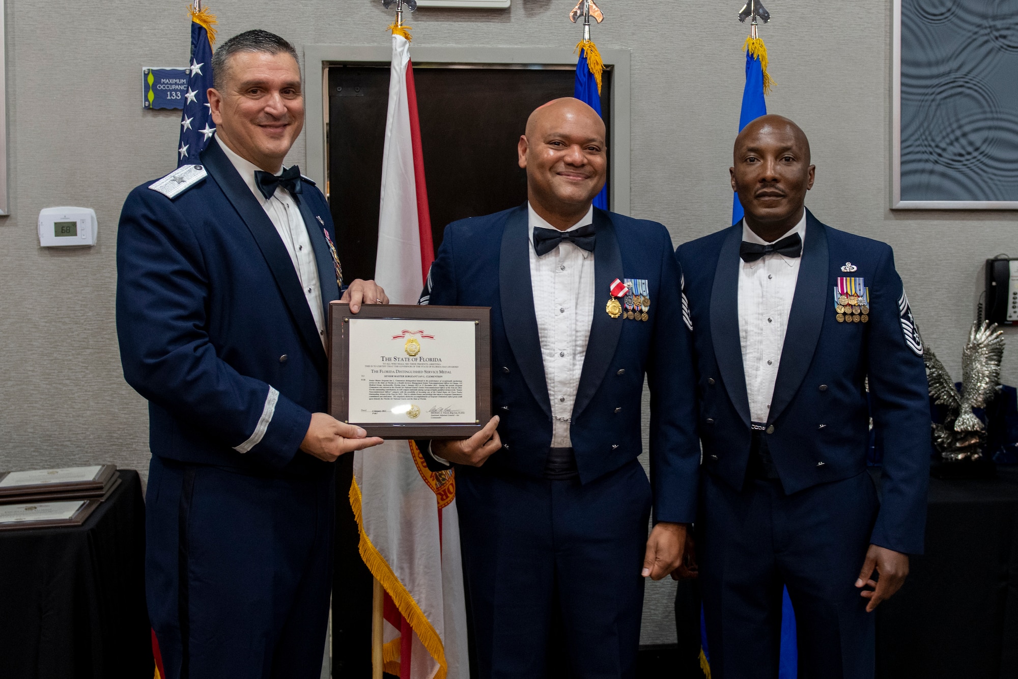 Senior Master Sgt. Ian Clementson receives the Florida Distinguished Service Medal at the Florida Air National Guard's Airman of the Year banquet held in Jacksonville, Fla. on January 8, 2022. Clementson holds the title of Airman of the Year for the Senior Non-Commissioned Officer category this year. The Airman of the Year award program is designed to recognize Airmen who display superior leadership, job performance and personal achievement during the prior calendar year. (U.S. Air National Guard photo by Senior Airman Jacob Hancock)