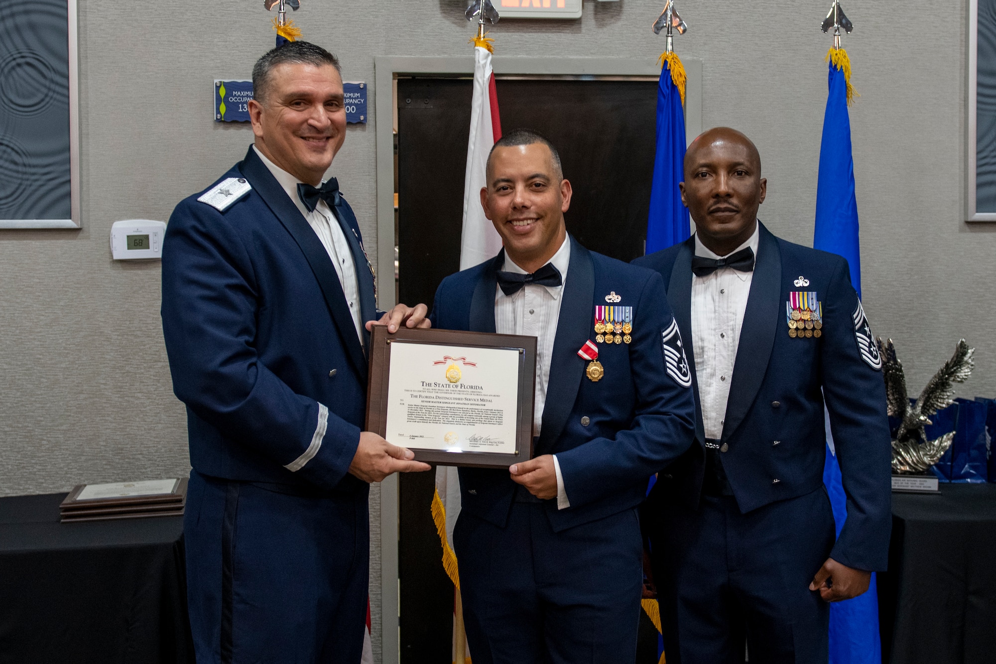 Senior Master Sgt. Jonathan Sotomayor receives the Florida Distinguished Service Medal at the Florida Air National Guard's Airman of the Year banquet held in Jacksonville, Fla. on January 8, 2022. Sotomayor holds the title of Airman of the Year for the First Sergeant category this year. The Airman of the Year award program is designed to recognize Airmen who display superior leadership, job performance and personal achievement during the prior calendar year. (U.S. Air National Guard photo by Senior Airman Jacob Hancock)