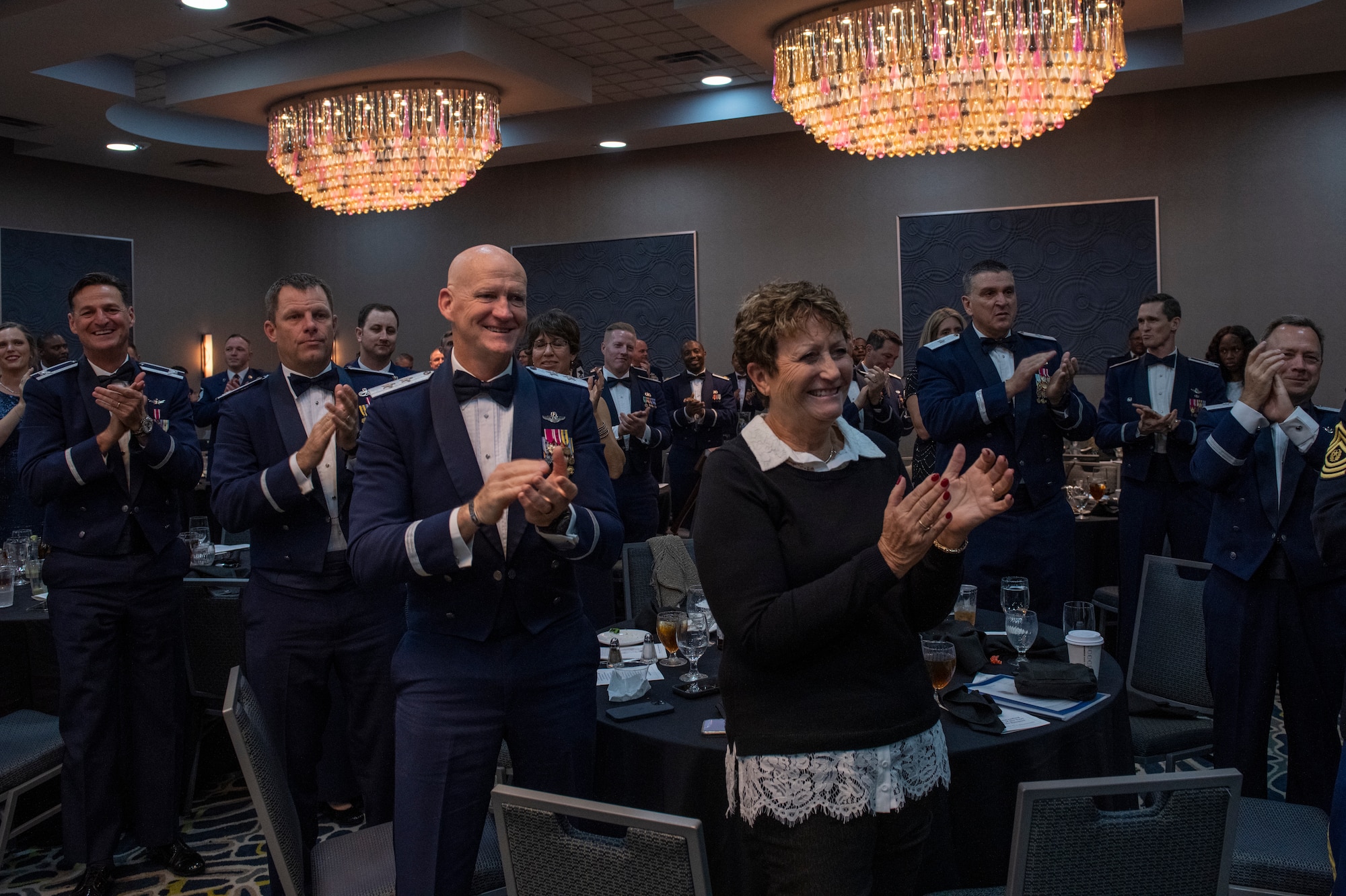 Airmen of the Florida Air National Guard honor the Airman of the Year recipients at a banquet in Jacksonville, Fla. on January 8, 2022. The Airman of the Year award program is designed to recognize Airmen who display superior leadership, job performance and personal achievement during the prior calendar year. Of the 15 nominees, 7 took home the title of Airman of the Year. (U.S. Air National Guard photo by Senior Airman Jacob Hancock)