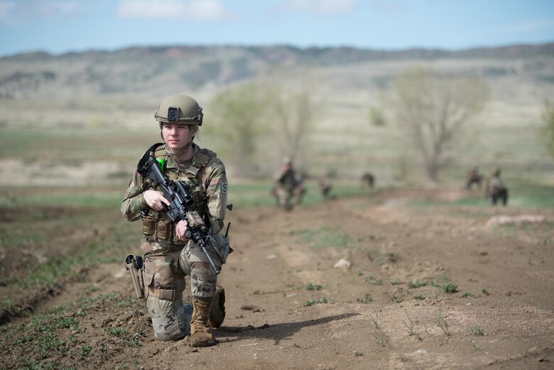 Airman 1st Class Kiara Rager, a fireteam member in the Kentucky Air National Guard’s 123rd Security Forces Squadron, takes up a defensive posture during a field training exercise at Fort Carson, Colo., May 19, 2021. More than 30 Airmen from the unit travelled here to strengthen their specialized skills during nine days of field exercises at several different ranges. (U.S. Air National Guard photo by Phil Speck)