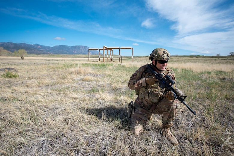 Tech. Sgt. Michael Burton, a fireteam member in the Kentucky Air National Guard’s 123rd Security Forces Squadron, takes up a defensive posture during a field training exercise at Fort Carson, Colo., May 19, 2021. More than 30 Airmen from the unit travelled here to strengthen their specialized skills during nine days of field exercises at several different ranges. (U.S. Air National Guard photo by Phil Speck)