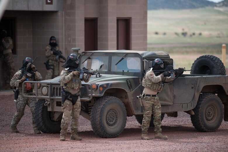 Members of the Kentucky Air National Guard’s 123rd Security Forces Squadron execute a simulated mission in a urban environment at Fort Carson, Colo., May 23, 2021. More than 30 Airmen from the unit travelled here to strengthen their specialized skills during nine days of field exercises at several different ranges. (U.S. Air National Guard photo by Phil Speck)