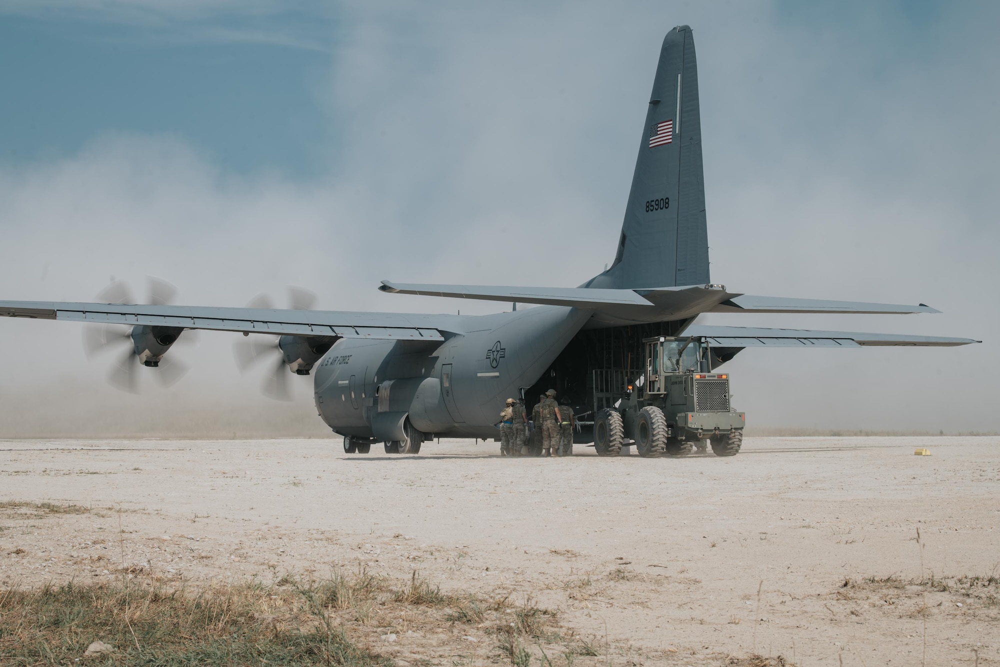 Airmen from the Kentucky Air National Guard’s 123rd Contingency Response Group perform an engine-running offload from a C-130 Hercules during a large-scale exercise in Logan, W.Va.., on July 22, 2021. The training took place during a week-long exercise named Sentry Storm 2021 that featured multiple units from the Air and Army National Guard, U.S. Air Force, Air Force Reserve, U.S. Navy and Civil Air Patrol. (U.S. Air National Guard photo by Staff Sgt. Vincent Santos)