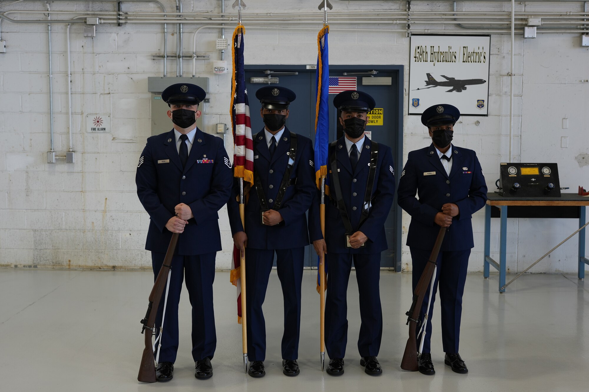 From left to right, Staff Sgt. Kevin Nemo, SrA Delvont’e Greenlee, SrA Trayvon Wheeler and SrA Raed Normil pose for a photo before presenting the colors, June 6, 2021, at Joint Base Andrews, Md. The 459th ARW Honor Guard currently has eight members and is looking to recruit new Airmen. (U.S. Air Force photo by SrA Andreaa Phillips)