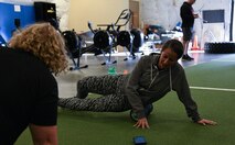 Photo of Airman using a foam roller