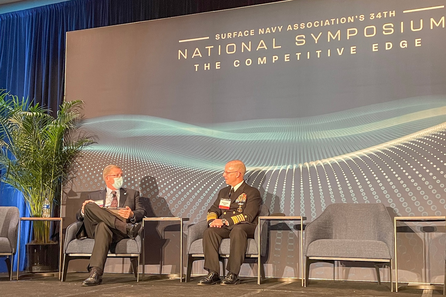 Adm. Daryl Caudle, commander, U.S. Fleet Forces Command (USFFC), speaks with the moderator and audience after giving a keynote address at the Surface Navy Association's 34th Annual National Symposium in Washington, D.C., Jan. 12, 2022.